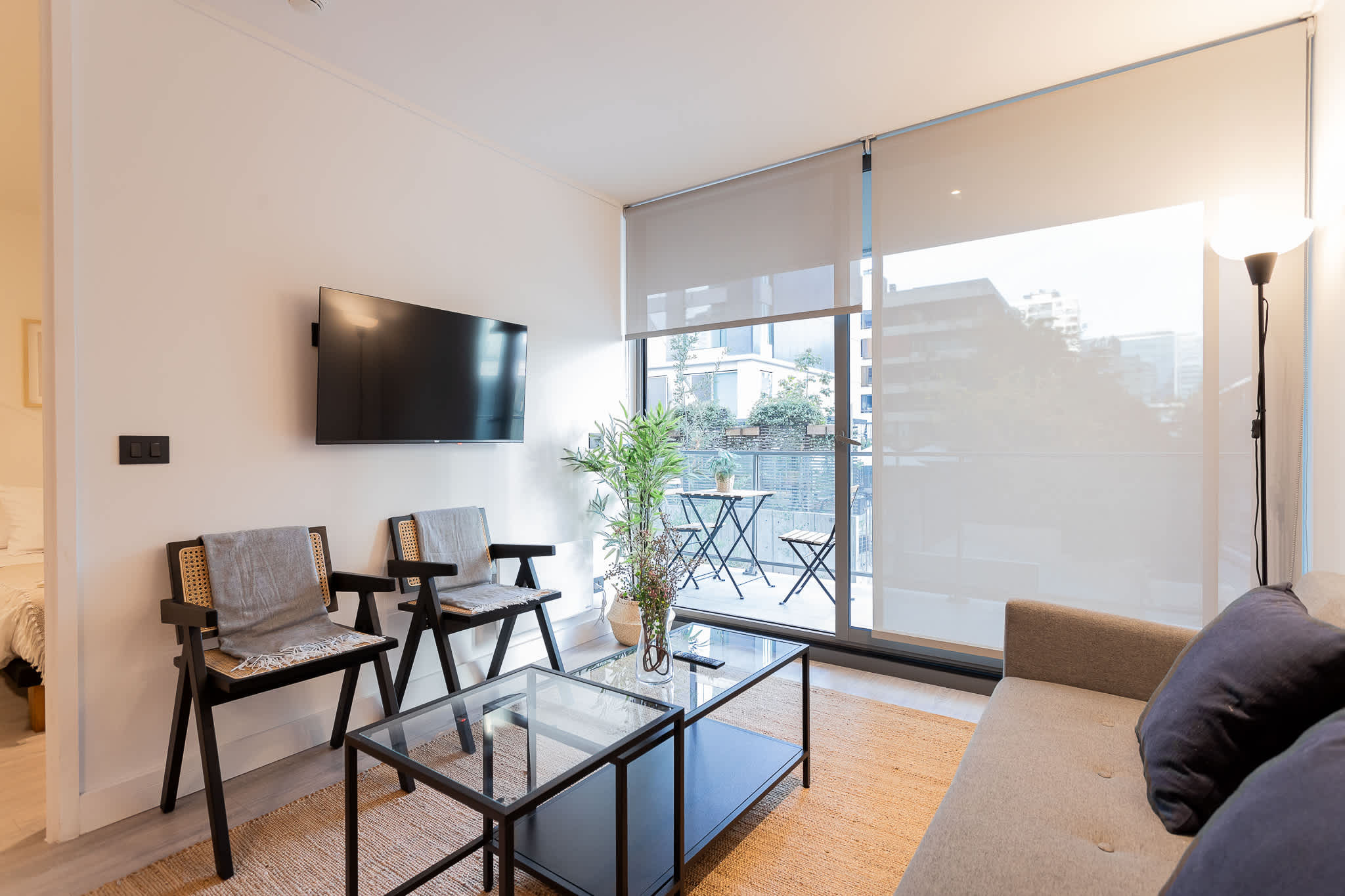 Relax in this modern living room with a cozy balcony, perfect for enjoying your morning coffee or evening views.