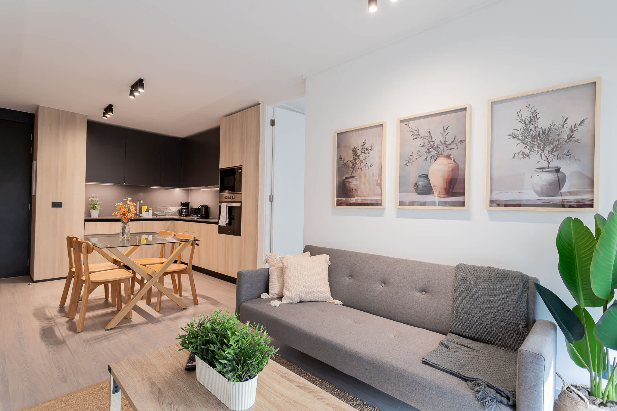 Relax in this chic living room with modern decor and a cozy ambiance, perfect for unwinding after exploring the city.
