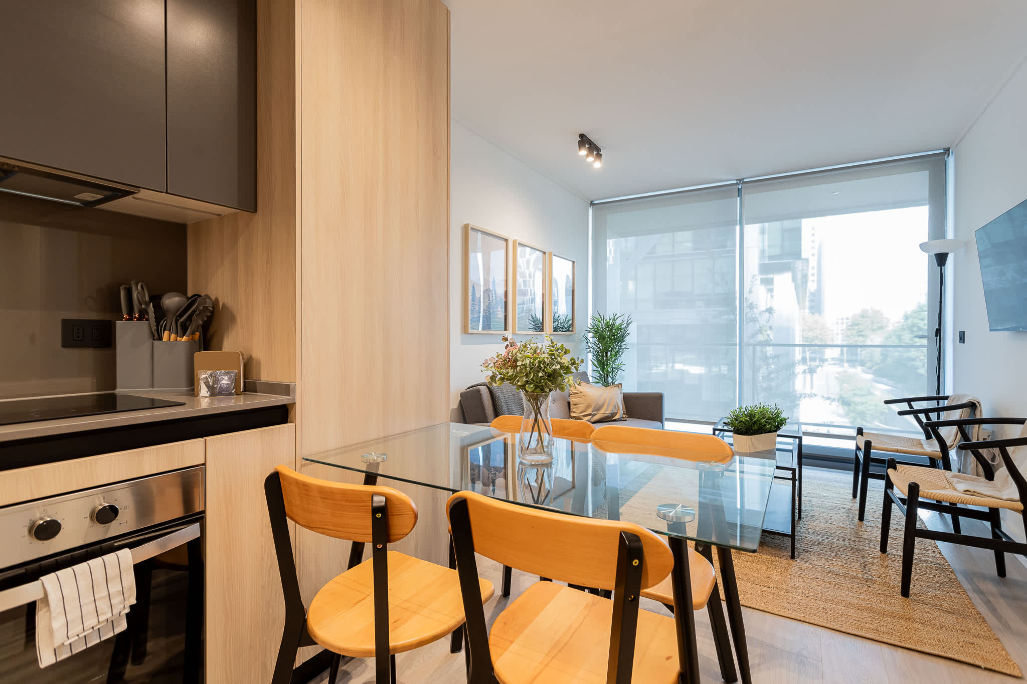 Bright and modern living space with a stylish kitchen and cozy seating, perfect for relaxing after a day of adventure.