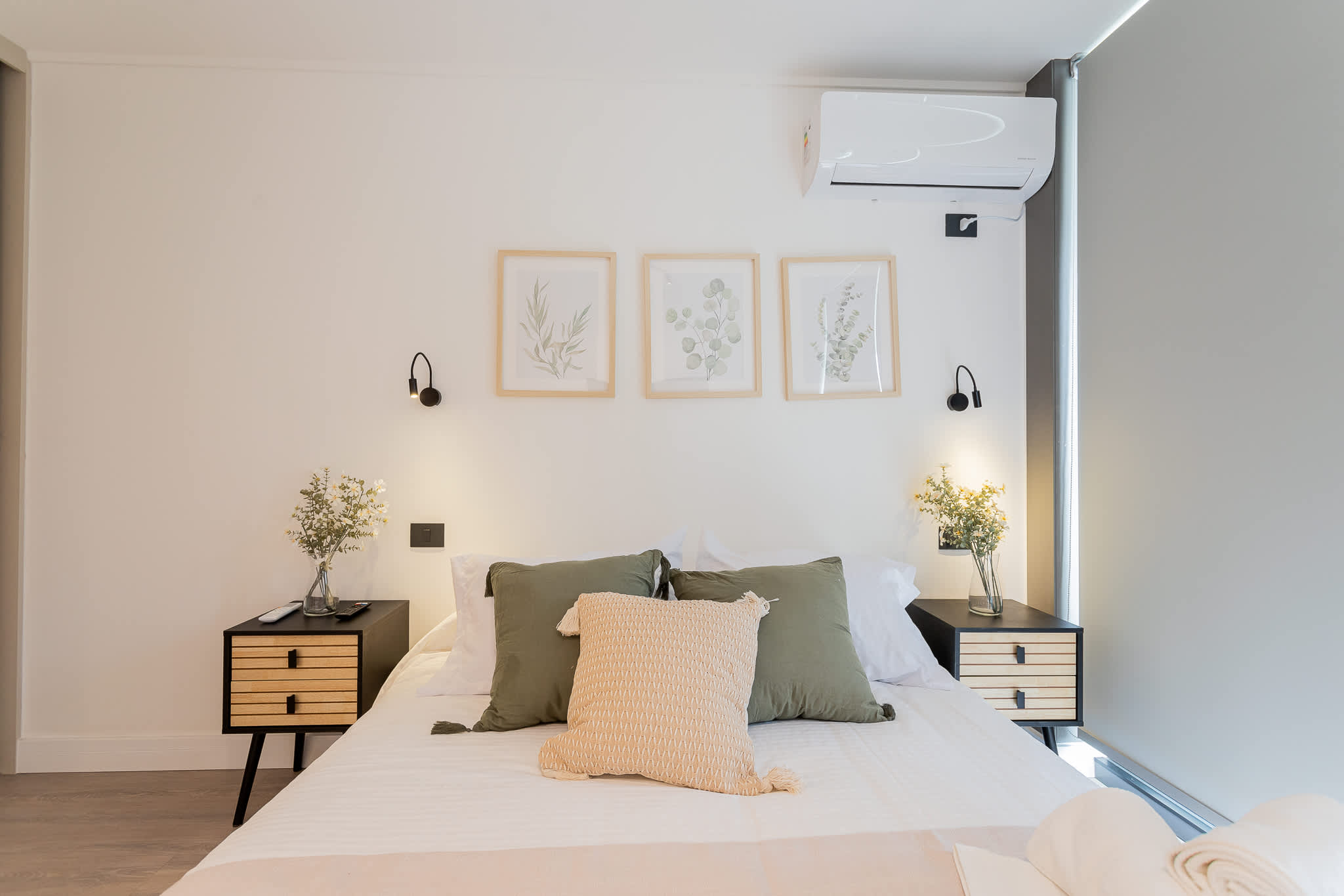 Experience tranquility in this beautifully designed bedroom, featuring elegant decor and natural light for a restful retreat.