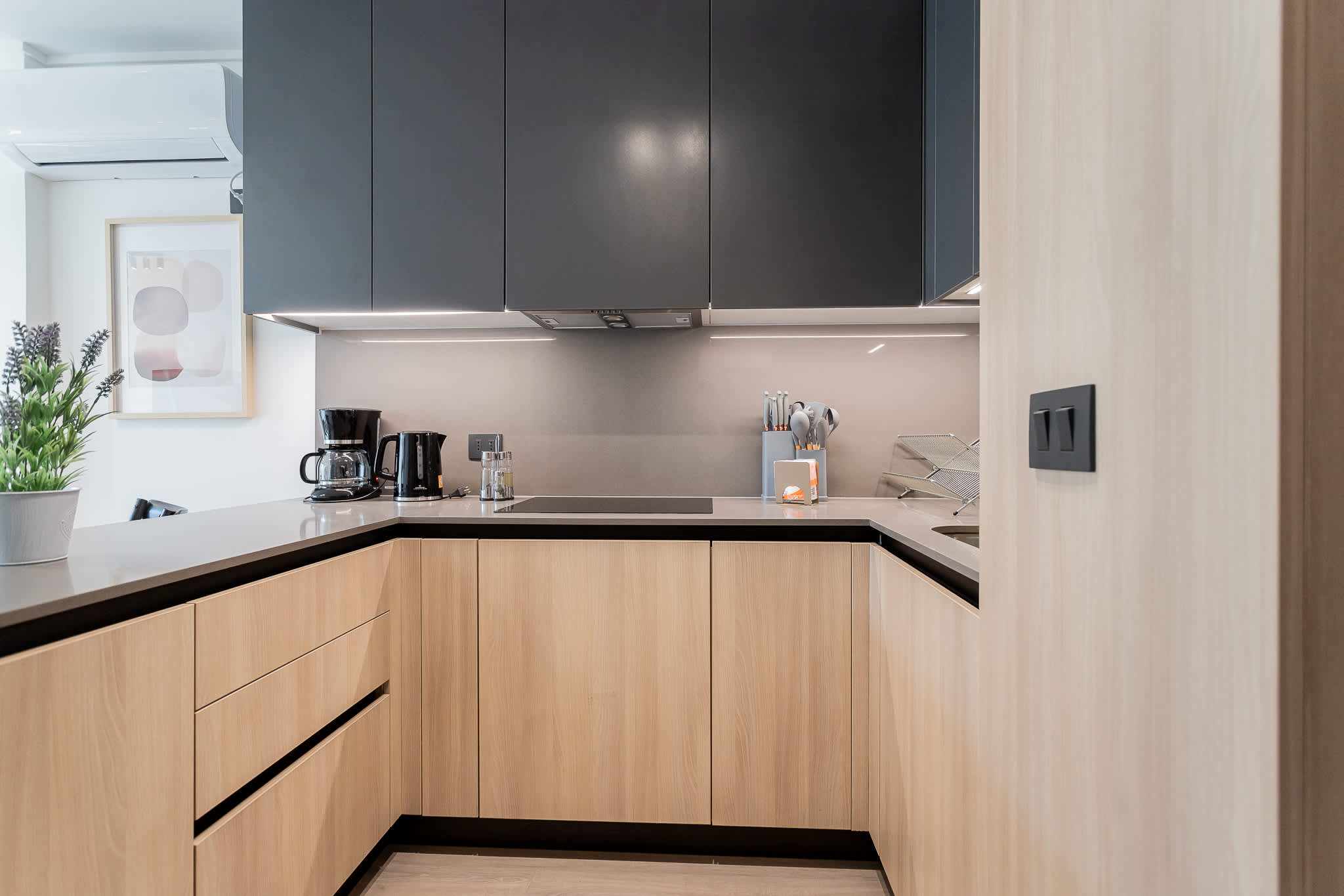 Sleek and modern kitchen with stylish cabinetry and essential amenities for a delightful cooking experience.