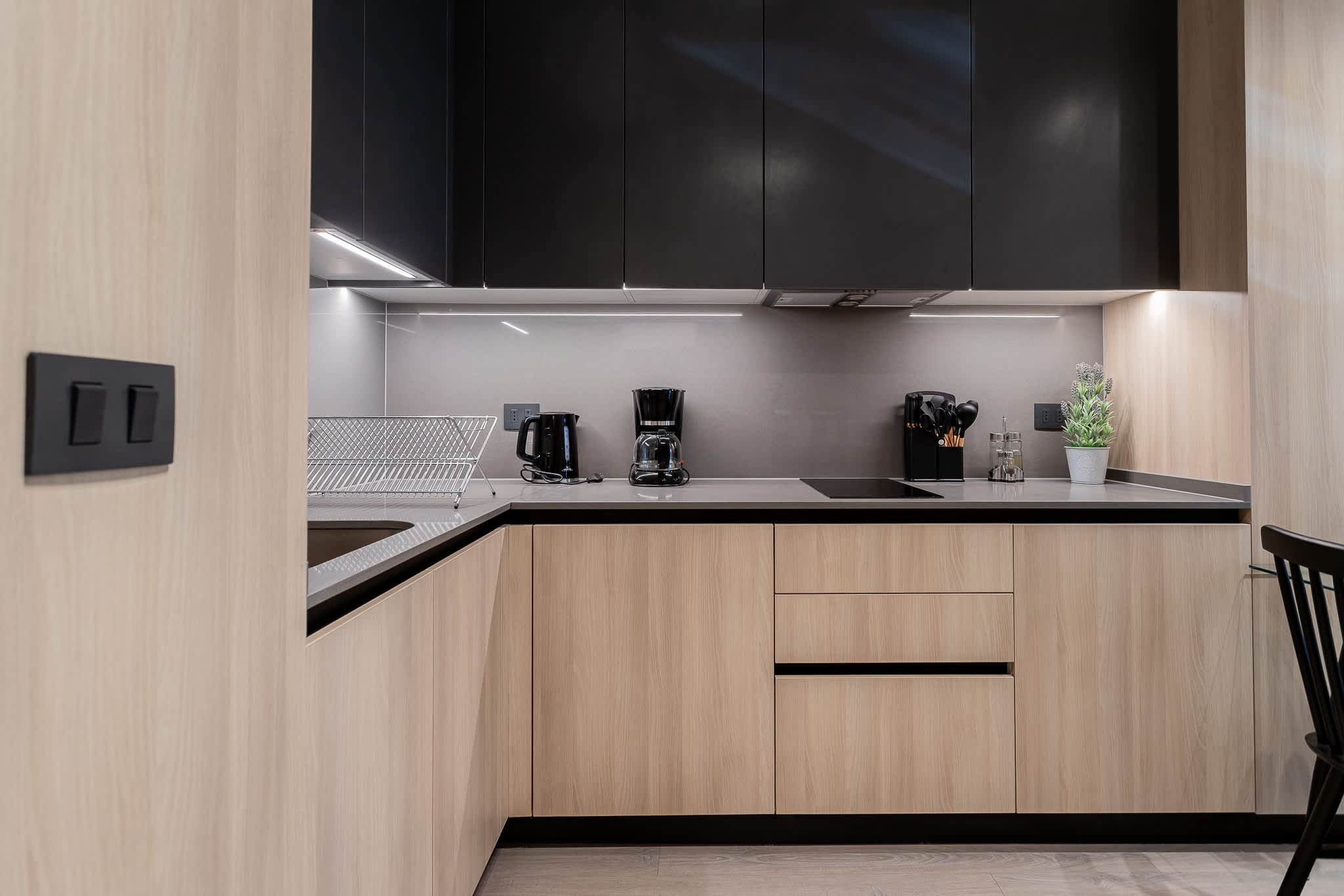 Experience a sleek and modern kitchen equipped with essential appliances, perfect for your culinary adventures during your stay!
