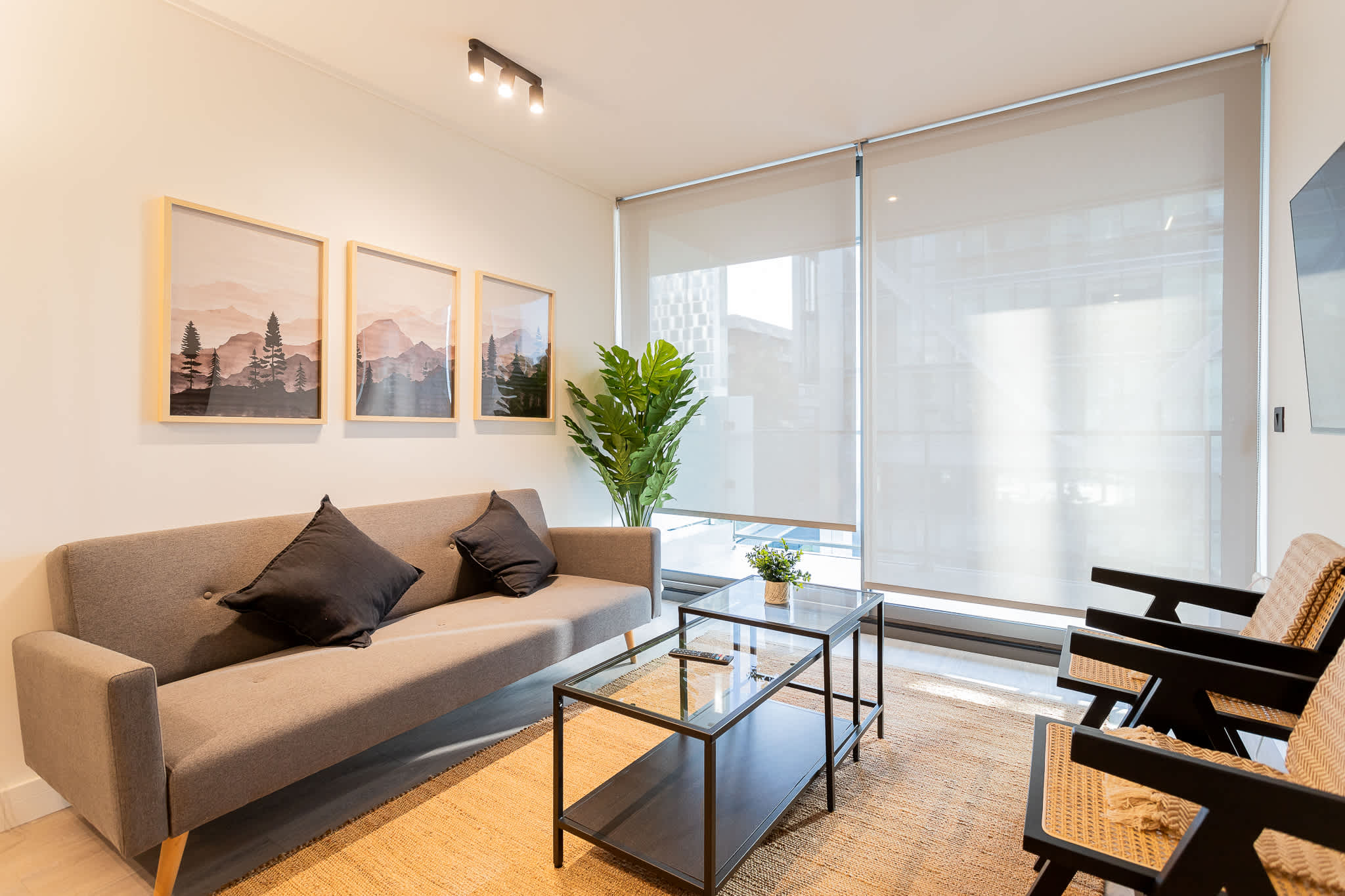 Bright and inviting living room with modern decor, perfect for relaxation after a day of exploring the city.