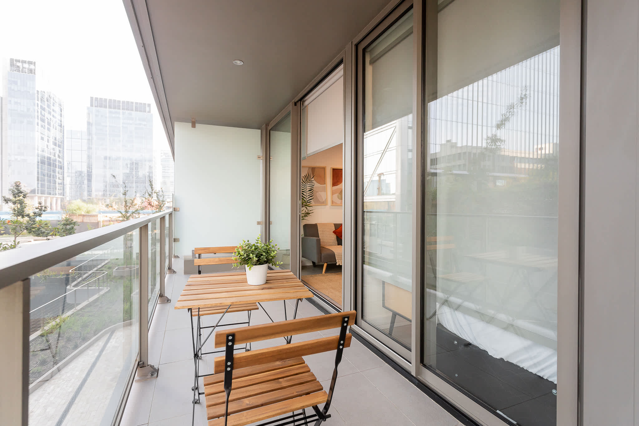 Relax on your private balcony with stunning Santiago city views.