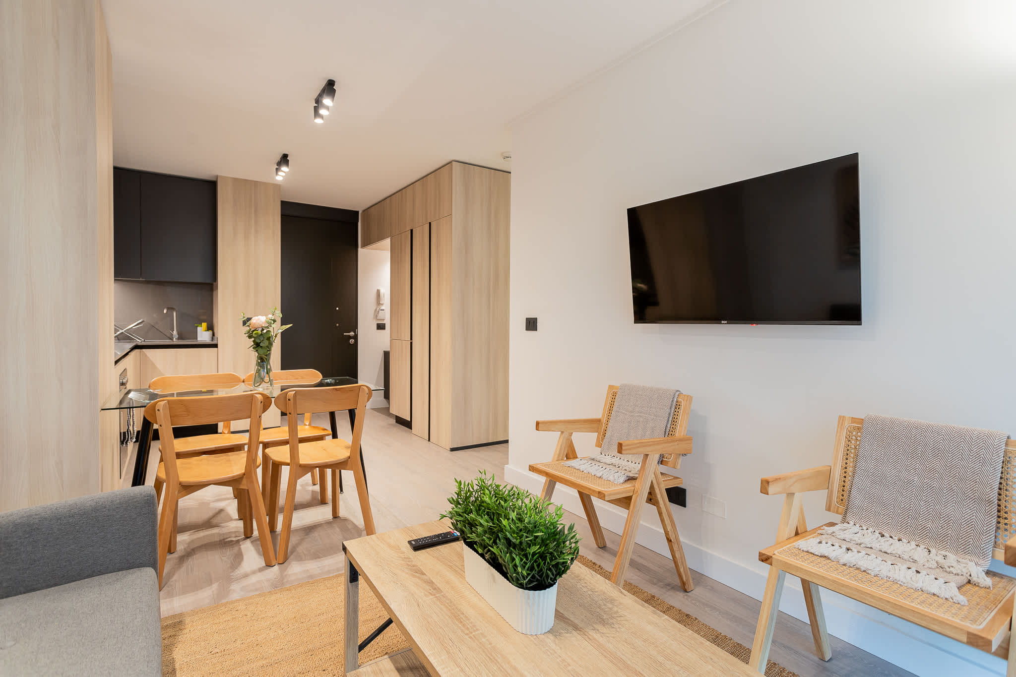 Modern living area with sleek design and cozy seating, perfect for relaxation and entertainment.