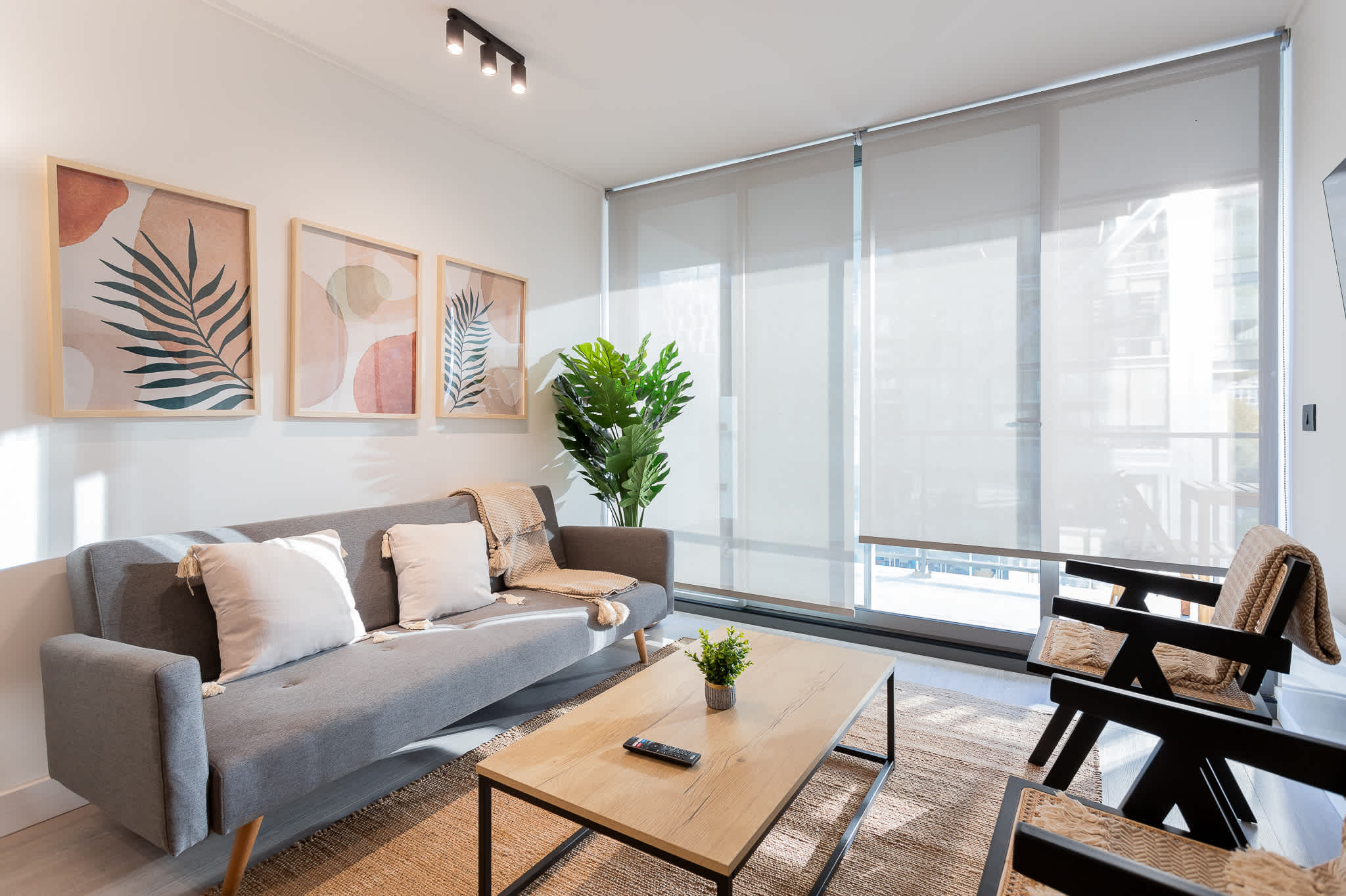 Bright and modern living room with stylish decor, perfect for relaxing after a day of adventures.