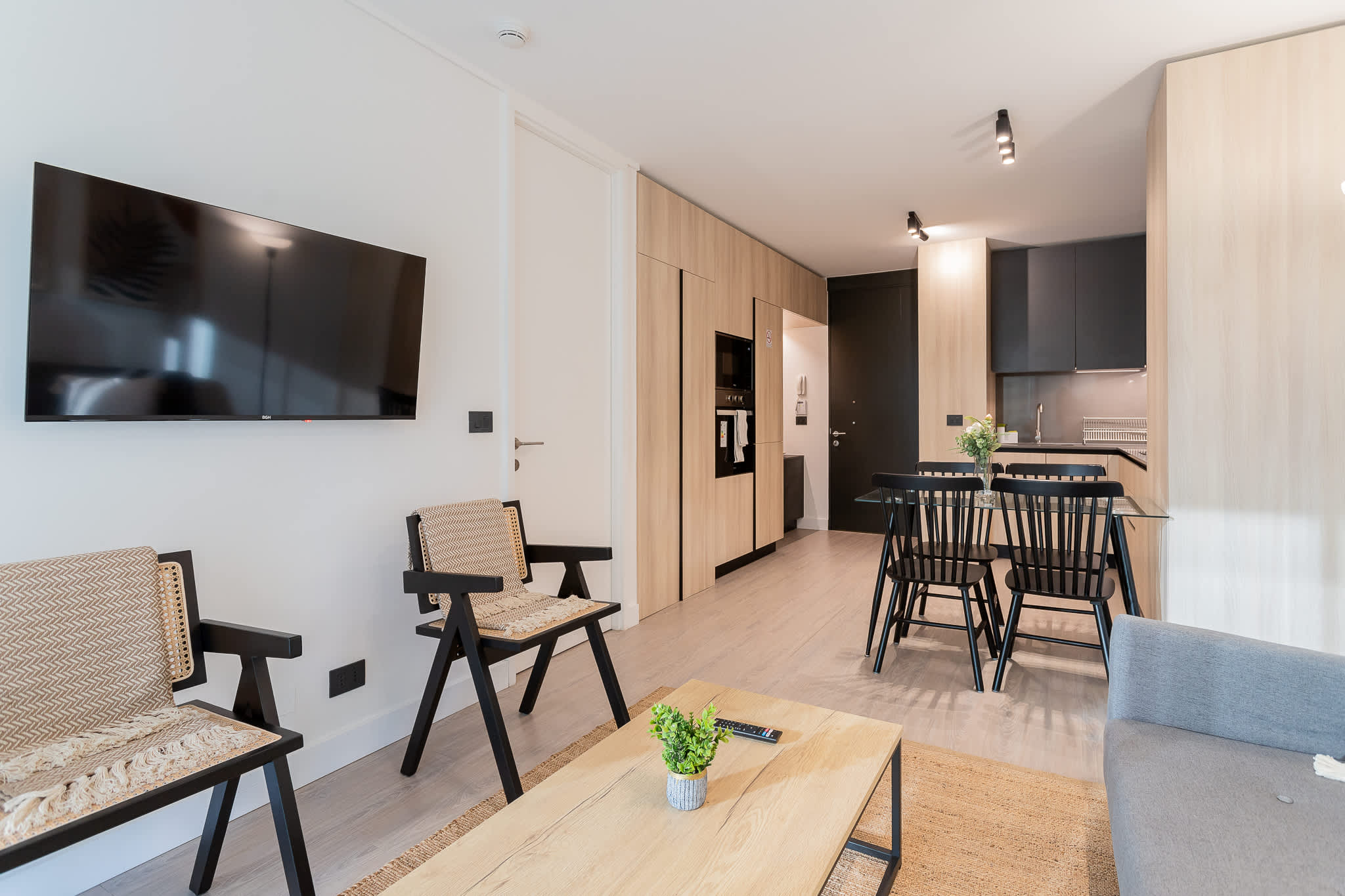 Experience modern comfort in this stylish living area, featuring sleek furniture and a cozy atmosphere perfect for relaxation.