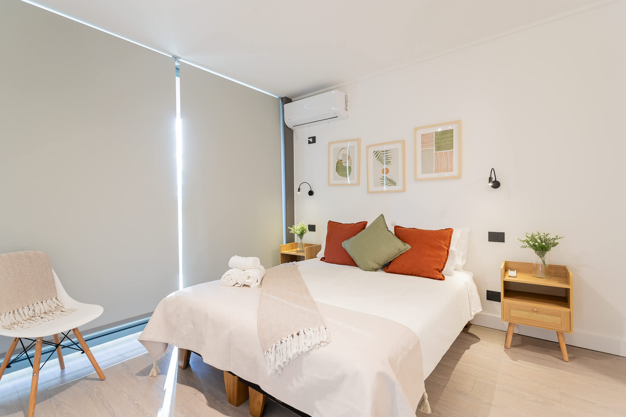 Experience comfort in this stylish bedroom, featuring cozy decor and natural light for a relaxing retreat.