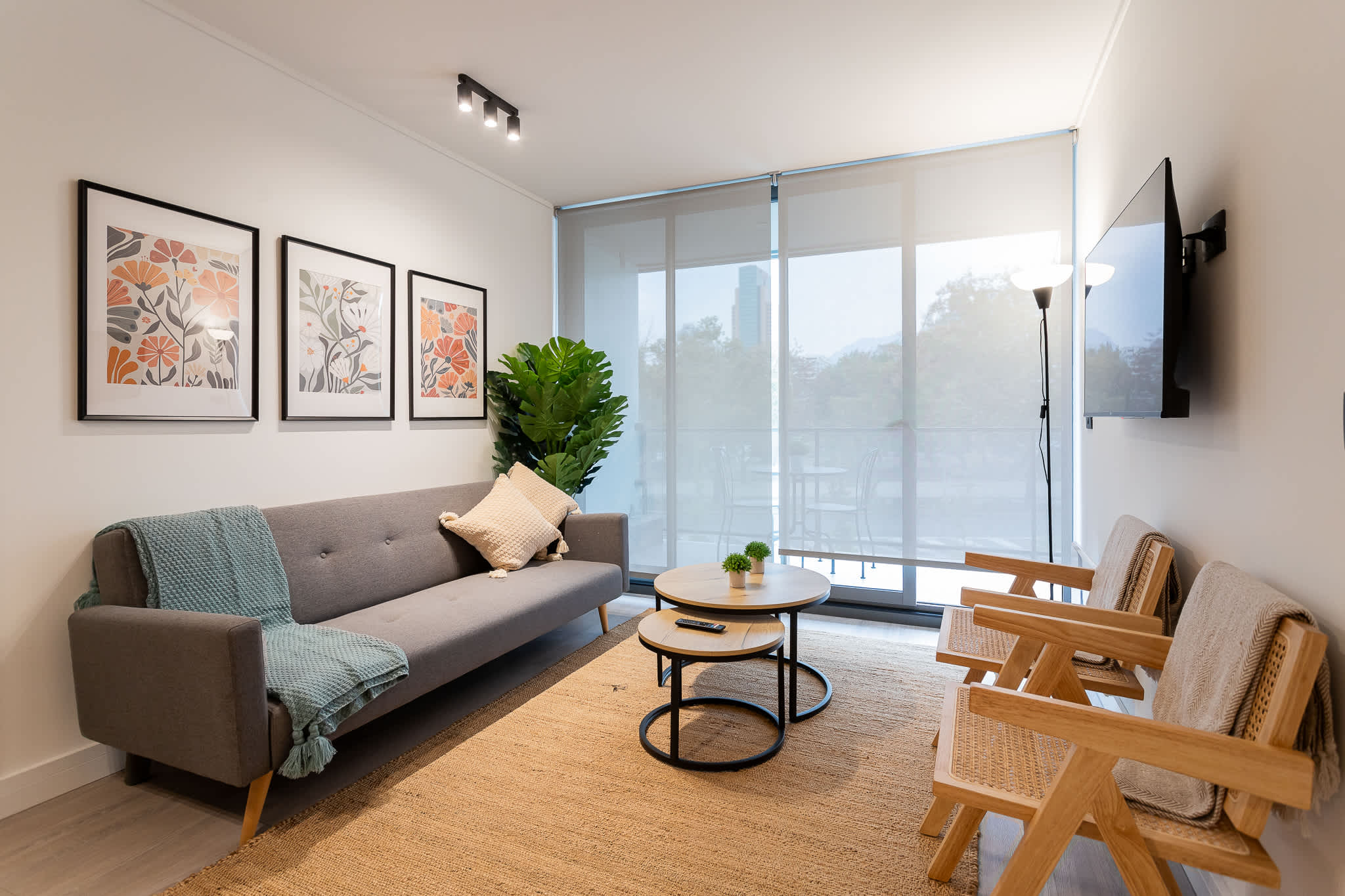 Stylish living room with modern decor, perfect for relaxation and enjoying natural light.