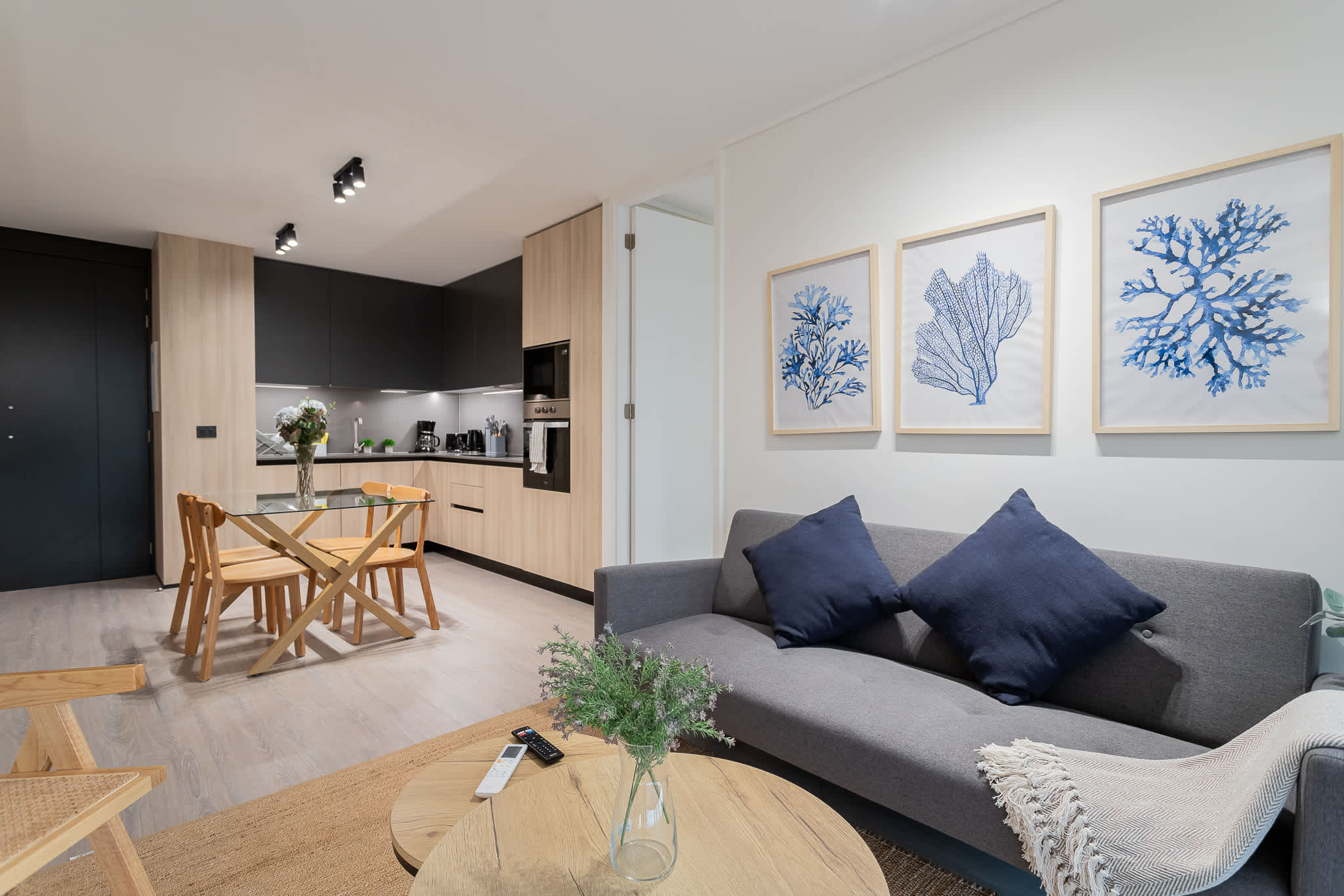 Experience modern comfort in this stylish living area, featuring a sleek kitchen and cozy seating—perfect for relaxing after a day of adventure!