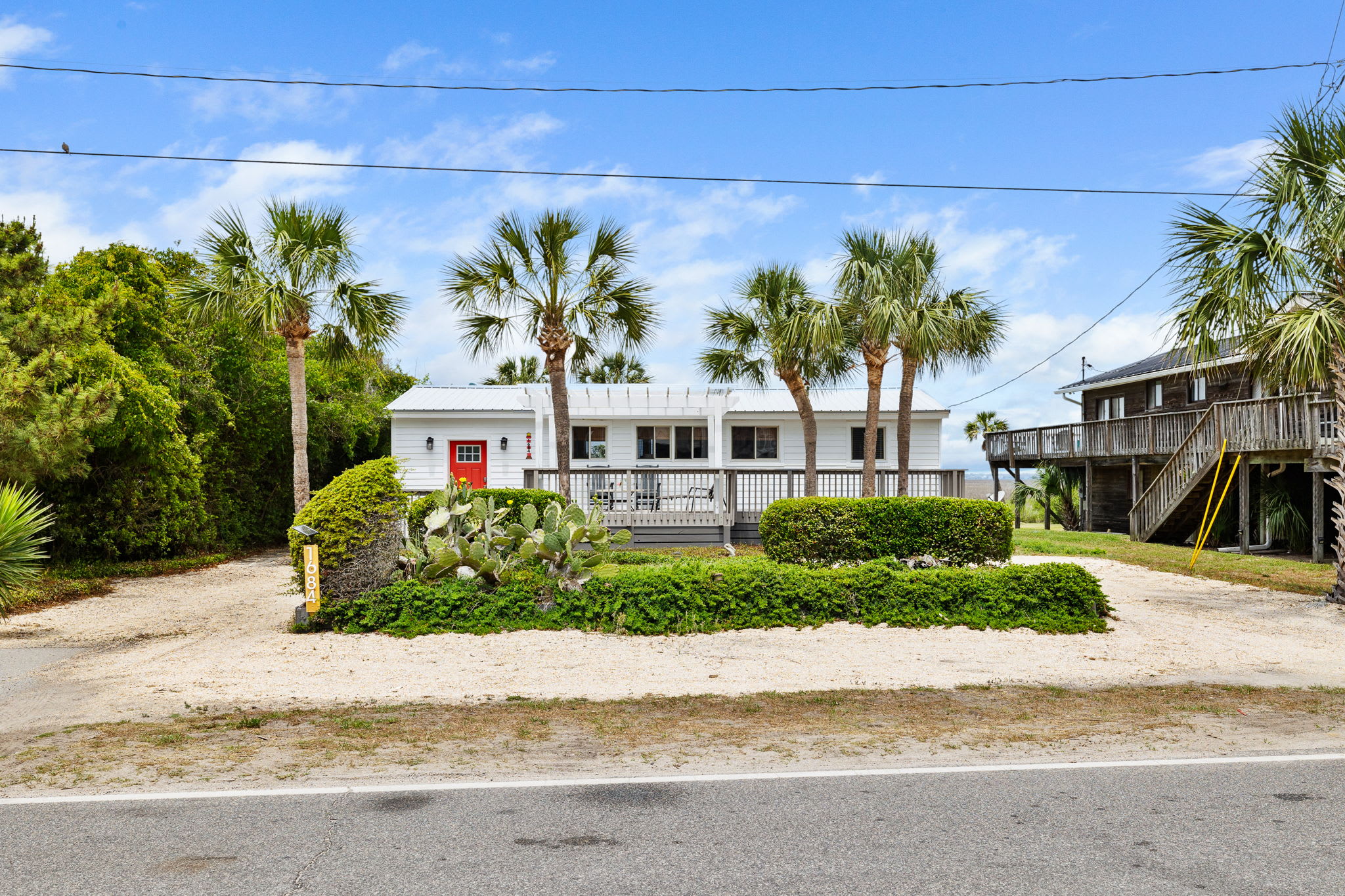Welcome to you Folly Beach Cottage! There are endless views of both the ocean and Folly Creek from the rooftop deck! Walk to the beach located just across the street 🙂 