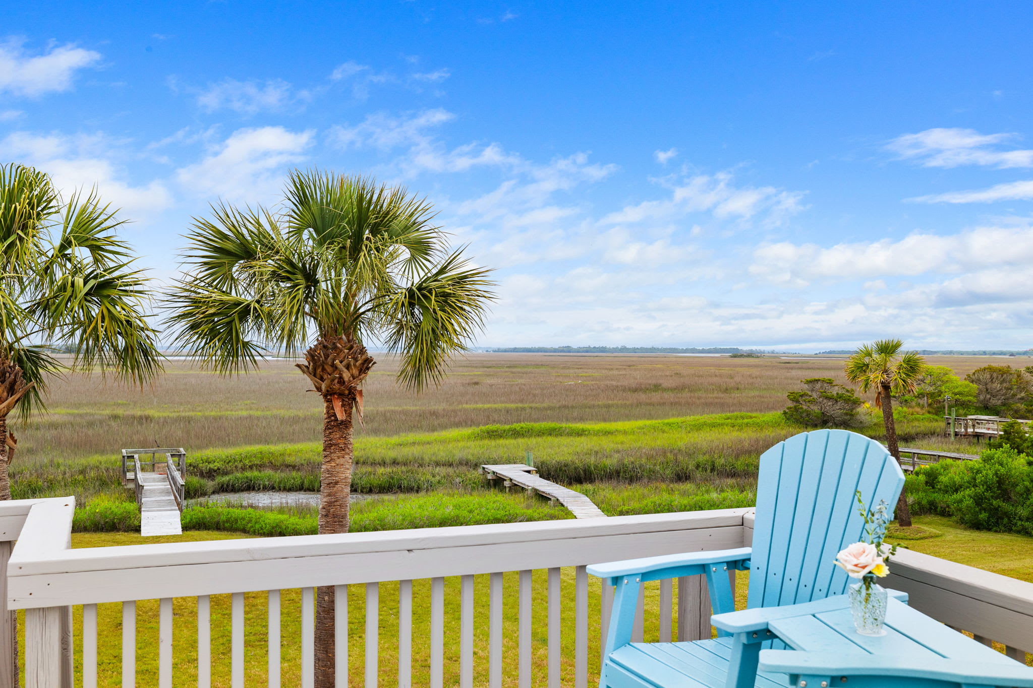 Large backyard that leads to the private dock on Folly Creek!