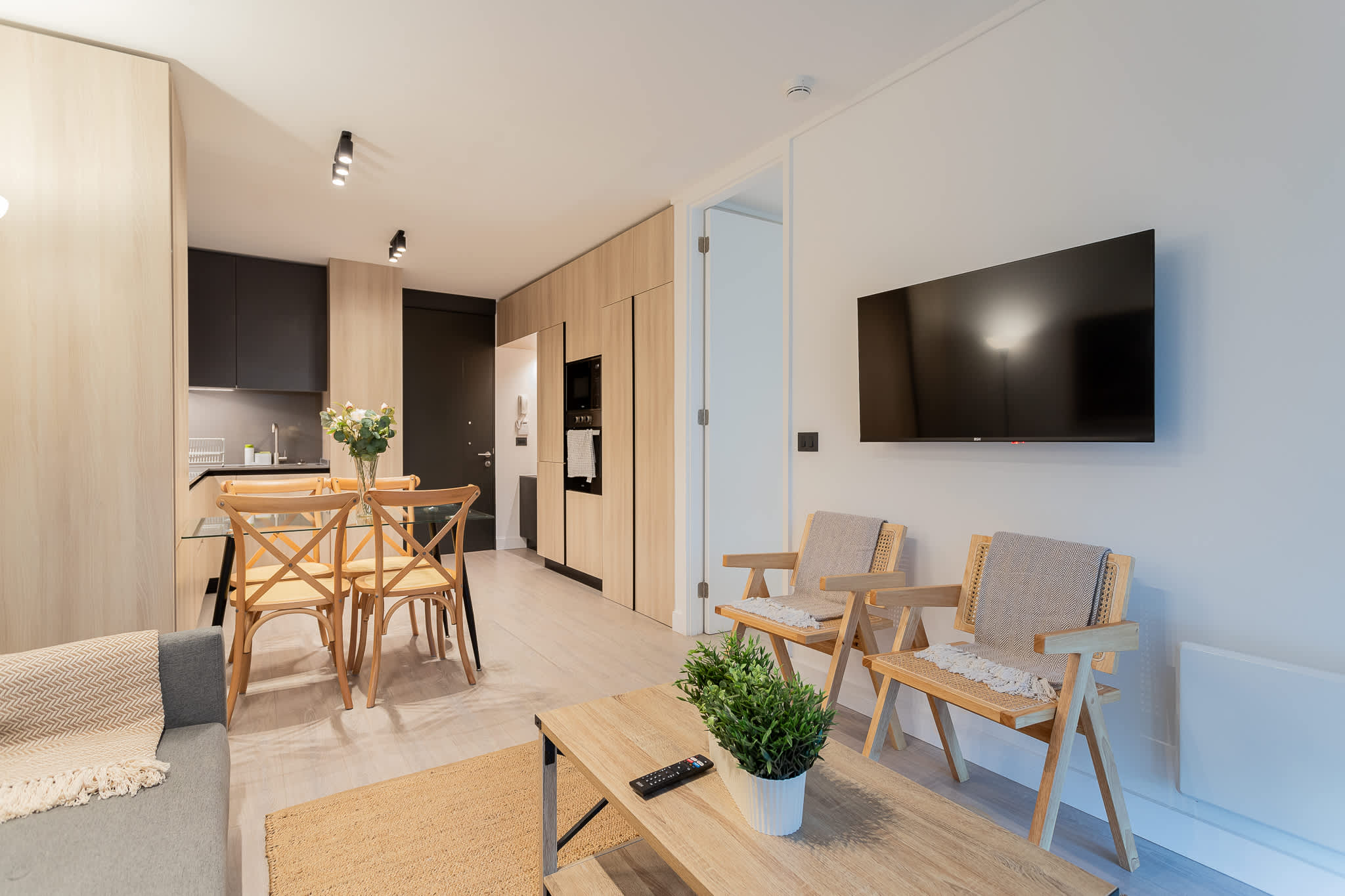 Cozy and modern living space with a stylish dining area, perfect for relaxing after exploring the city.