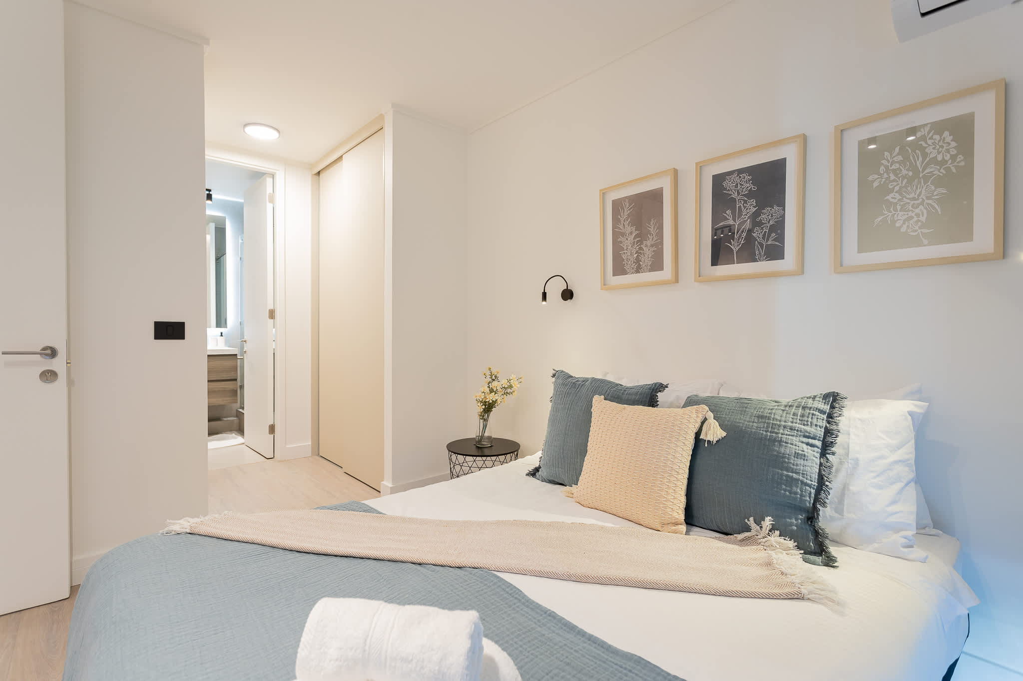 Relax in this cozy bedroom with elegant decor and a private ensuite bathroom for a perfect retreat.