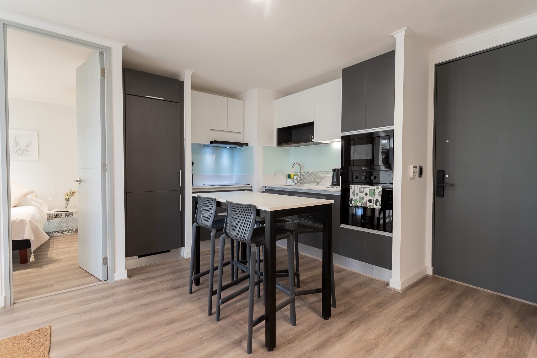 Sleek and modern kitchen with dining space, perfect for enjoying meals and gatherings.