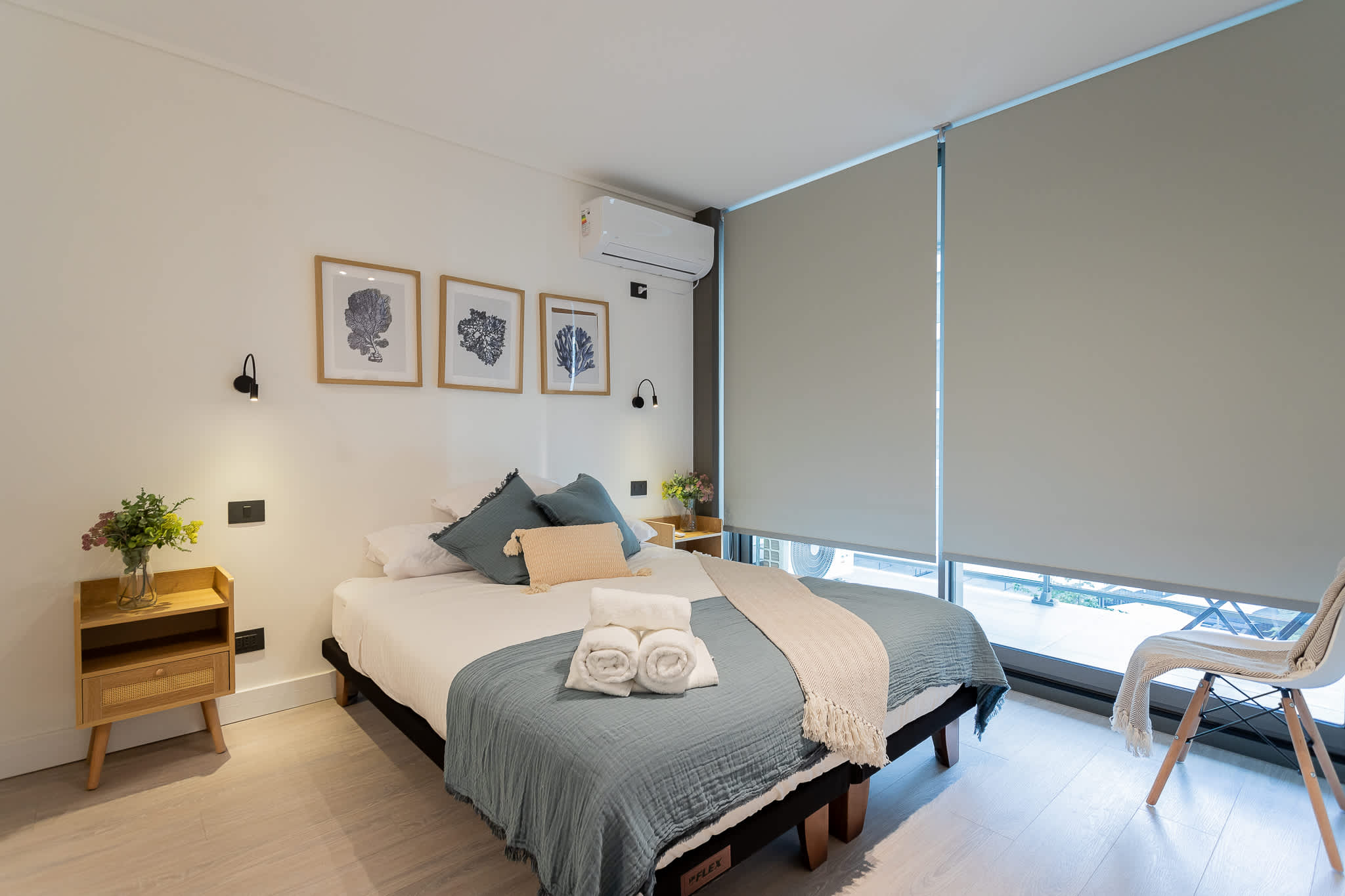 Experience comfort in this stylish bedroom with modern decor, perfect for a relaxing getaway.