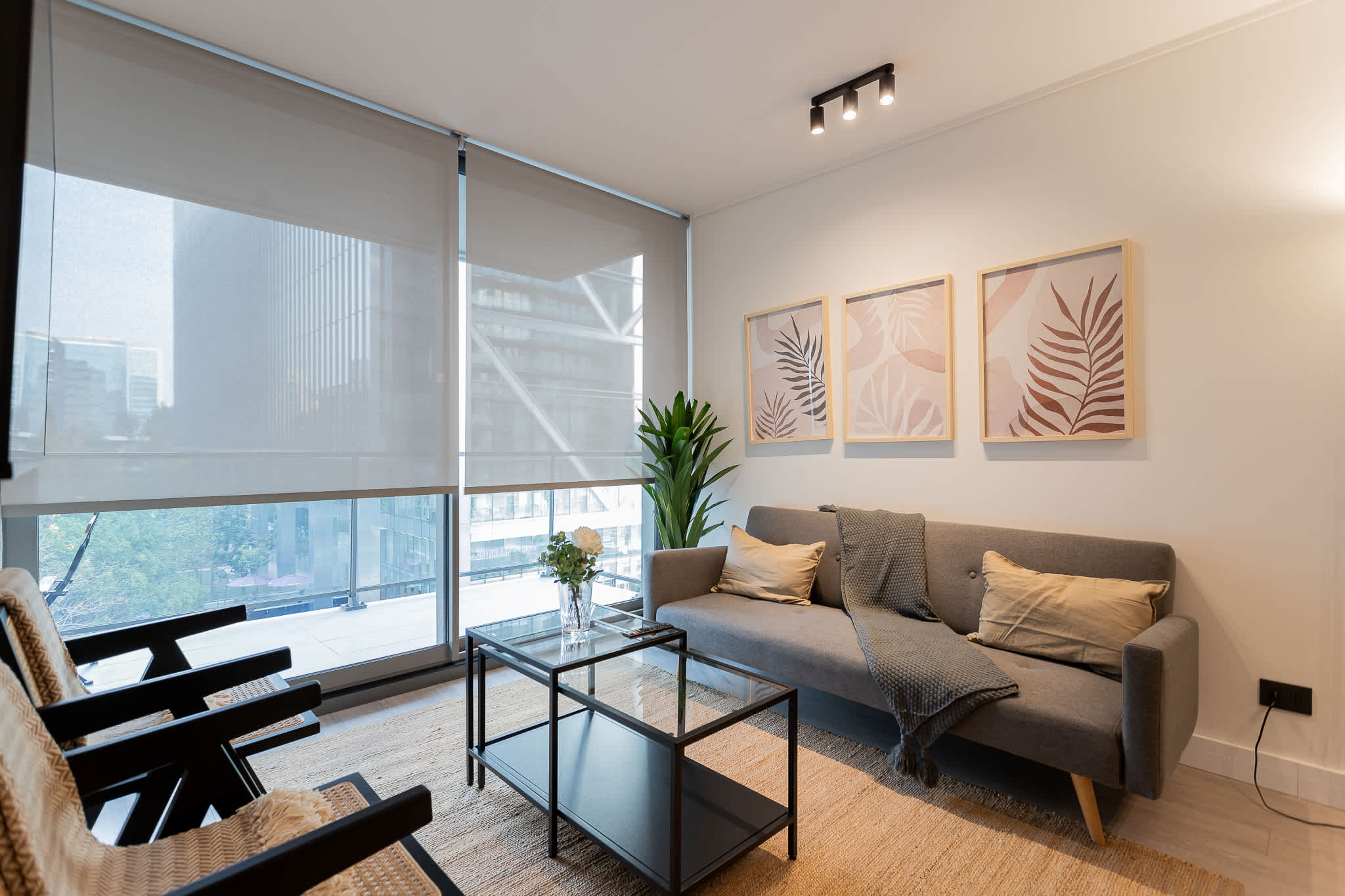 Stylish living room with city views, perfect for relaxation and enjoying modern comforts.