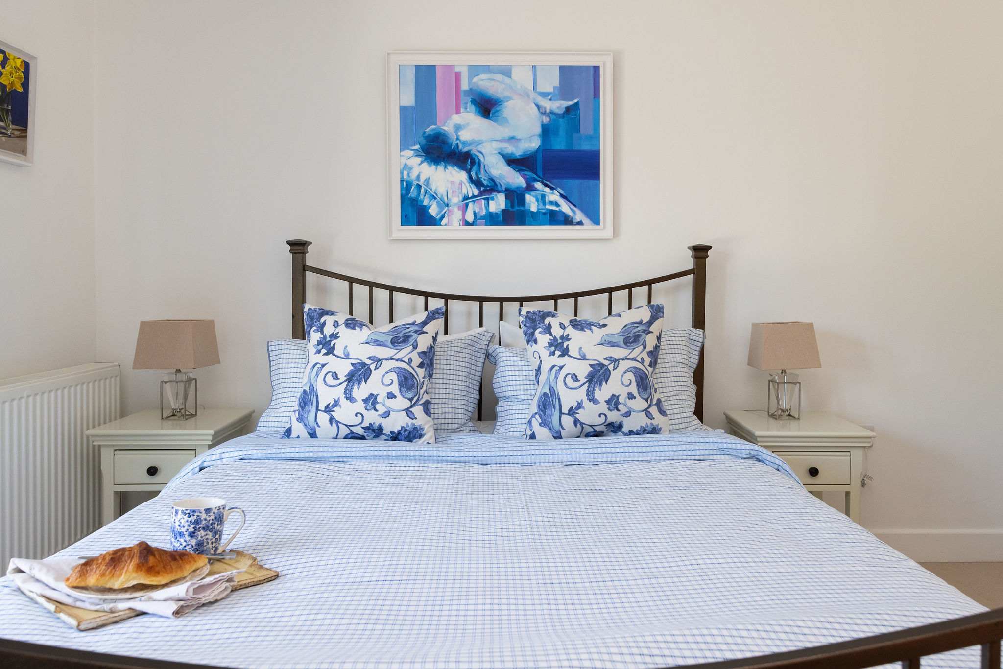 This king size bed offers ultimate comfort for a restful night's sleep.