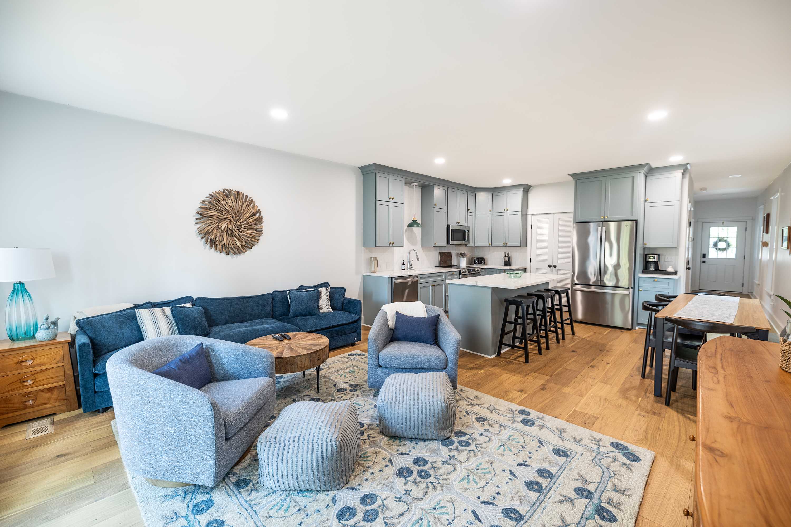 Open concept of living, kitchen & dining areas