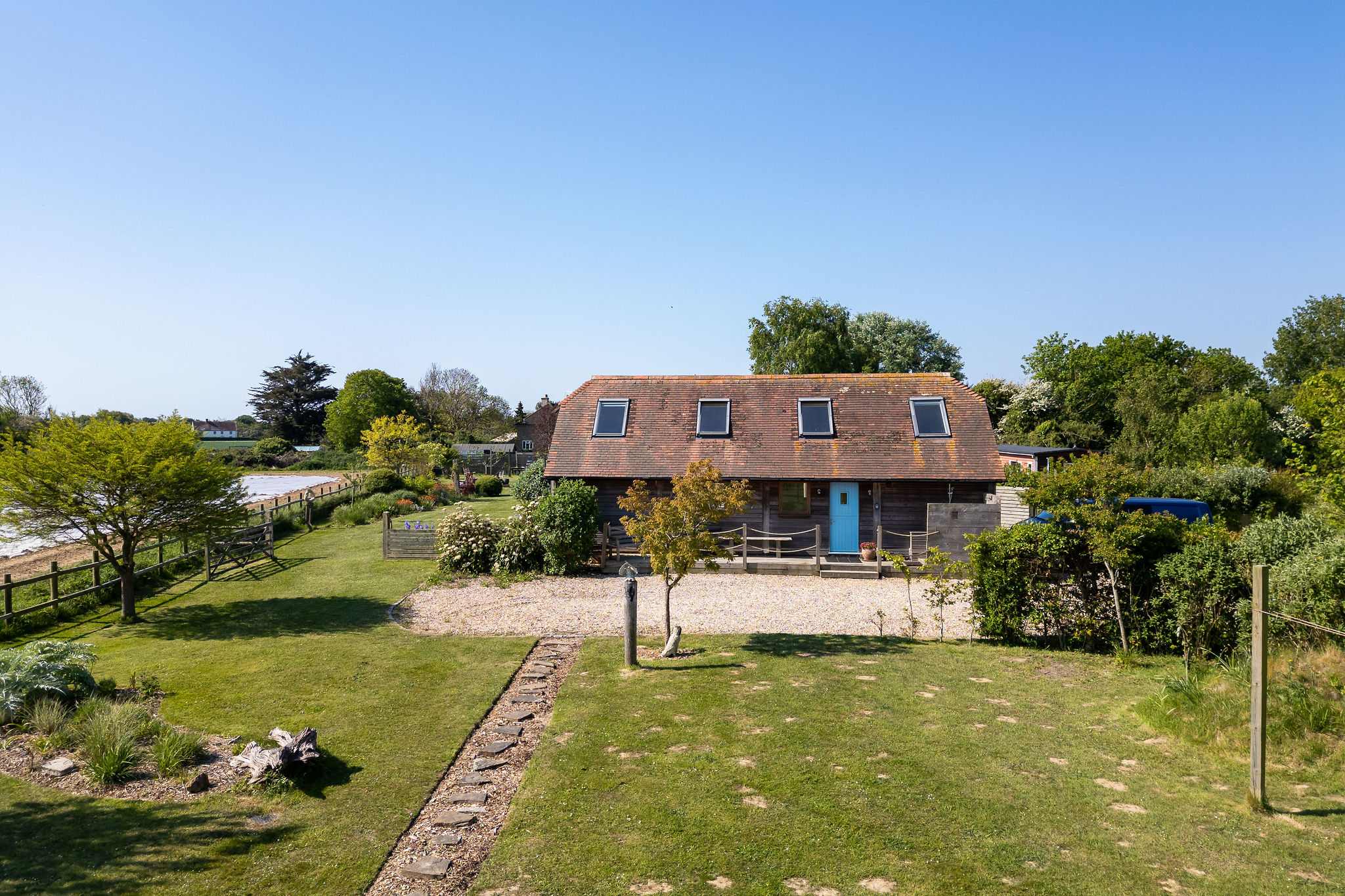 A peaceful haven with ample lawn space and serene views.