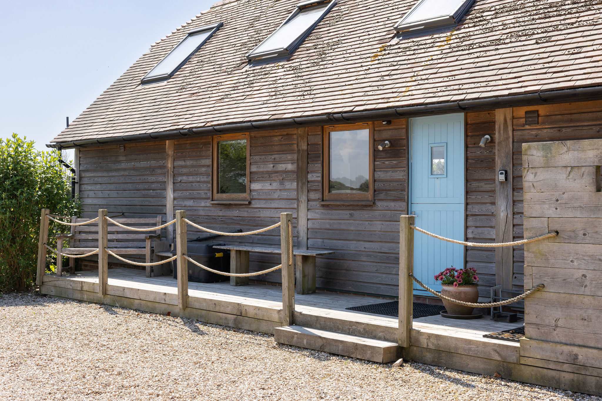 Relax on the deck of this unique West Wittering getaway.
