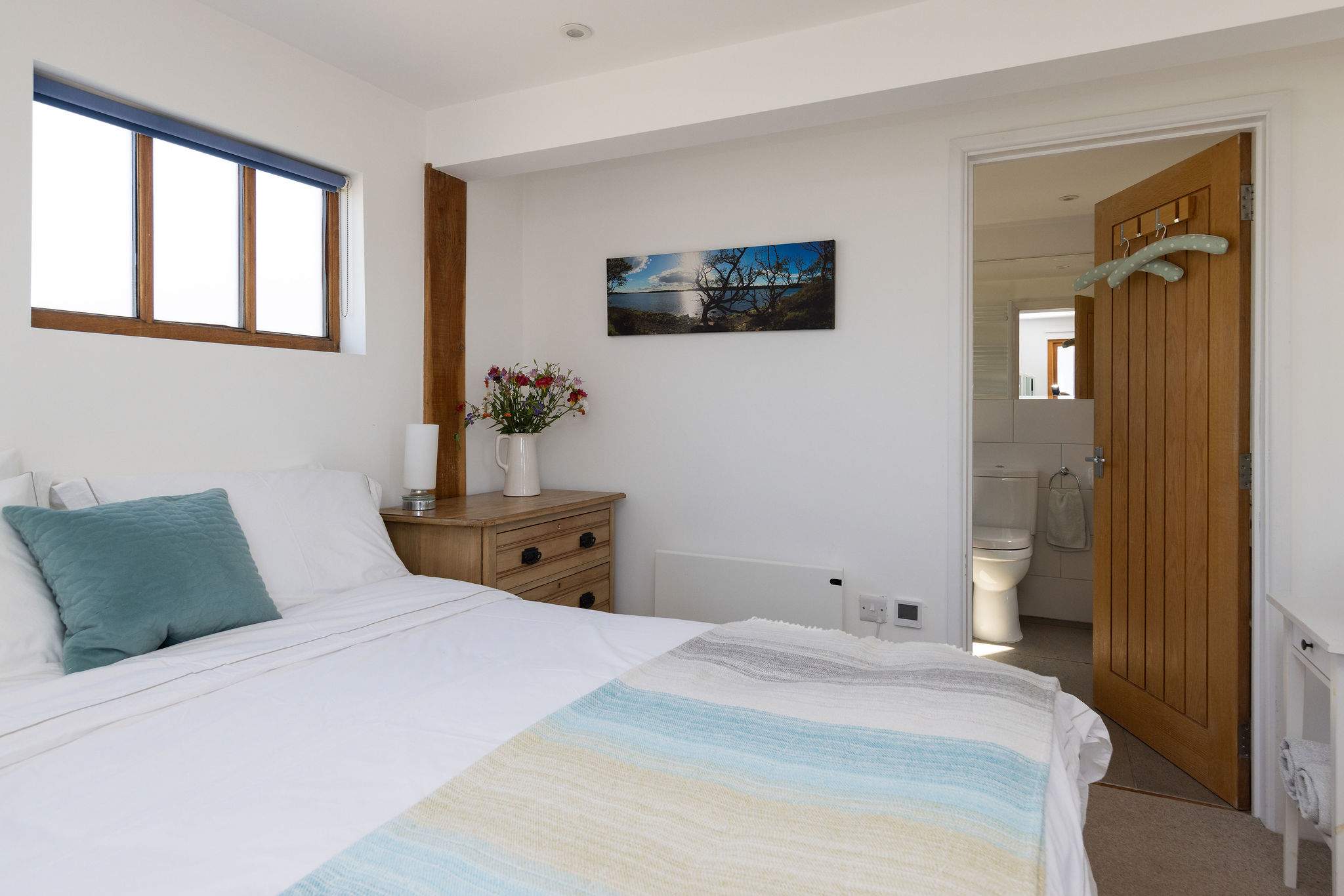 Spacious master bedroom with a convenient en-suite bathroom.