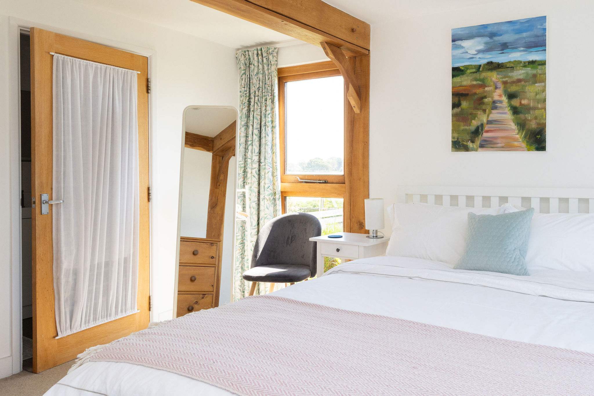Light-filled master bedroom with a beautiful view