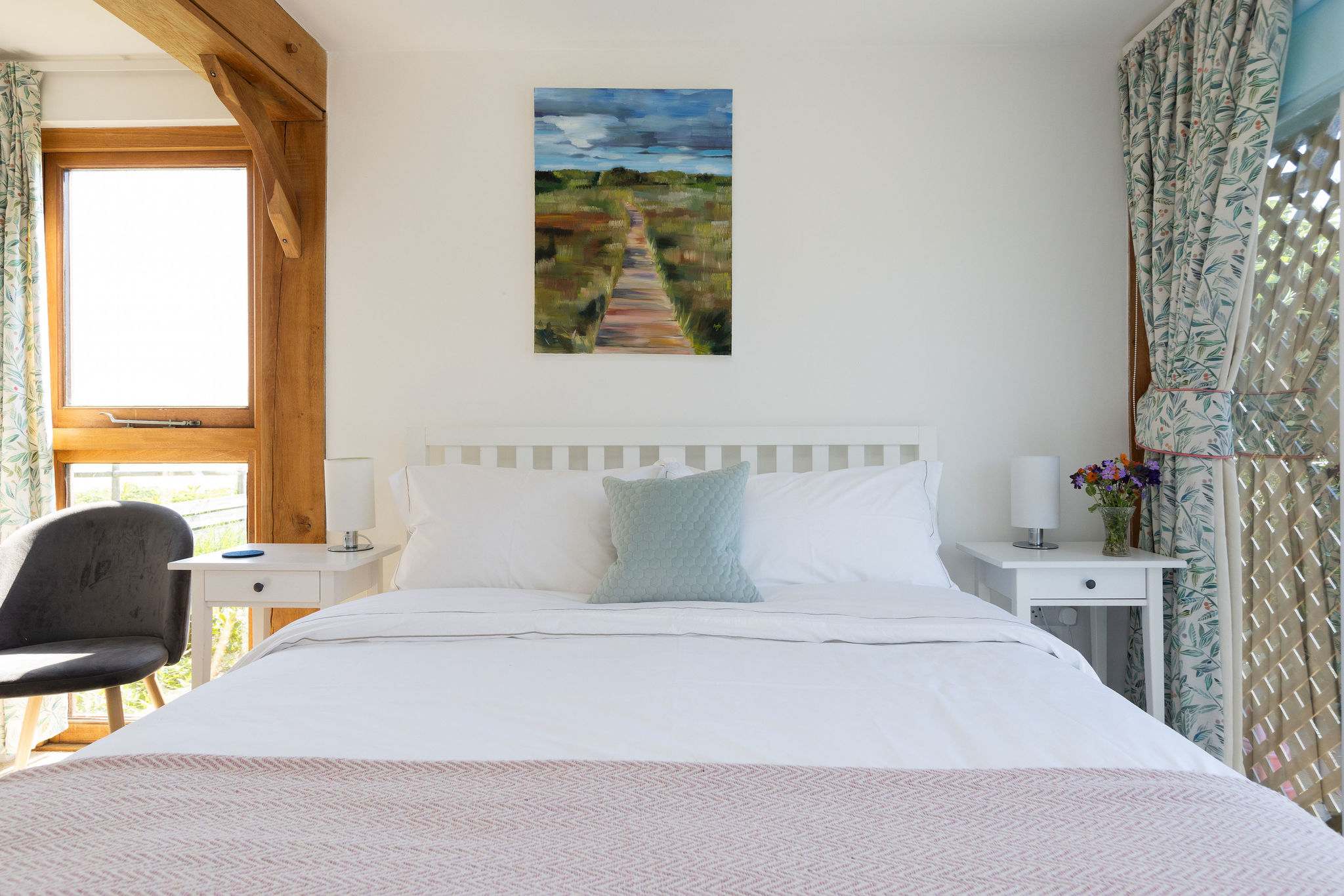 Bright and airy bedroom with beautiful view.