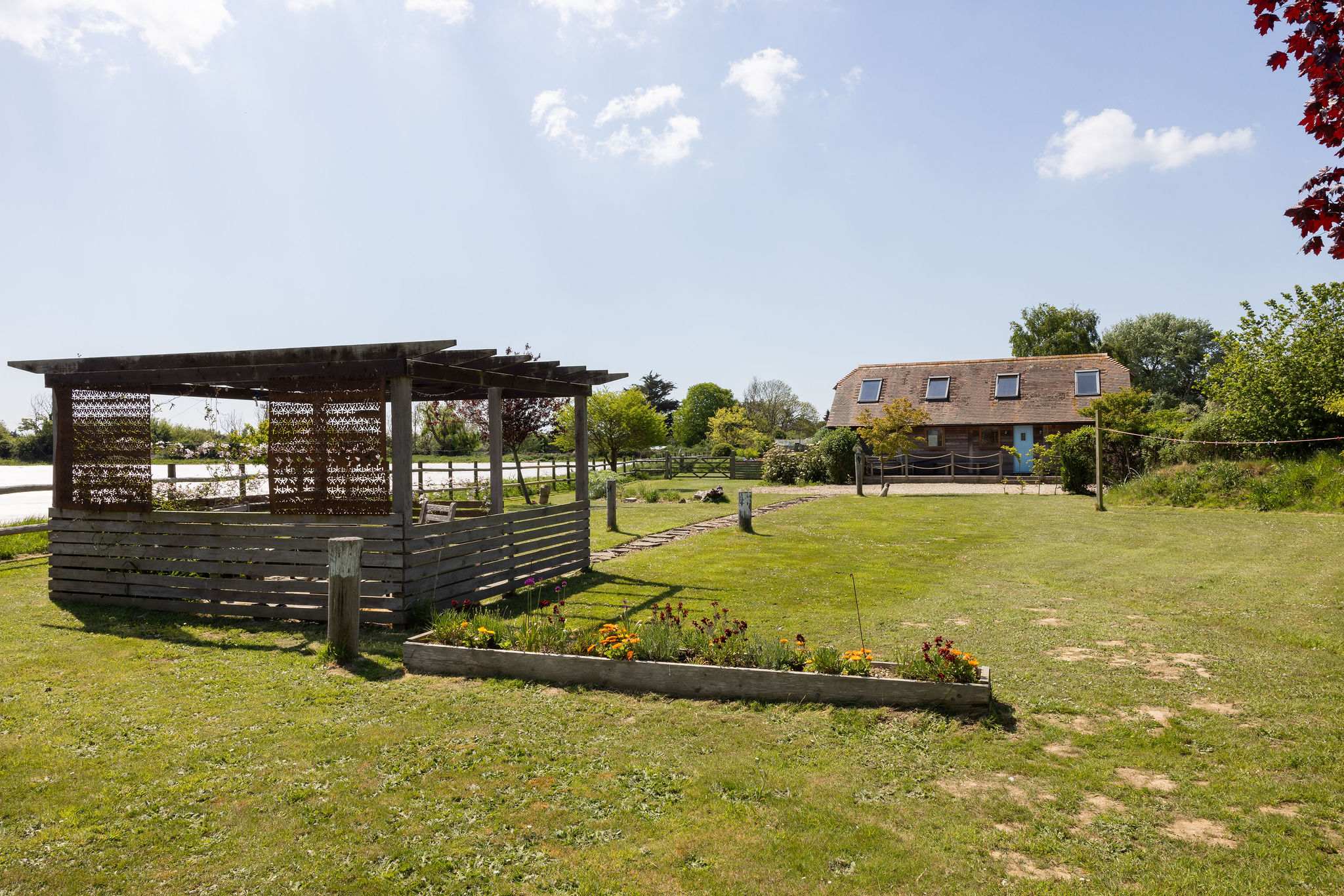 This property offers a wonderful outdoor space with comfortable seating to enjoy the serene surroundings.