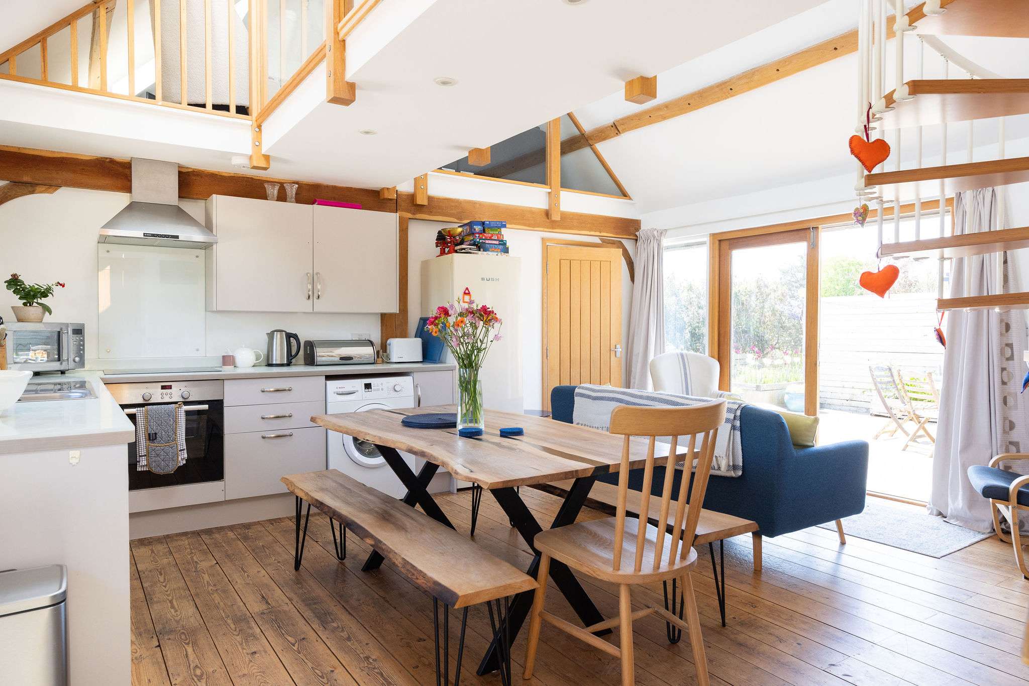 Enjoy cooking and dining together in the inviting barn conversion, offering both style and comfort.