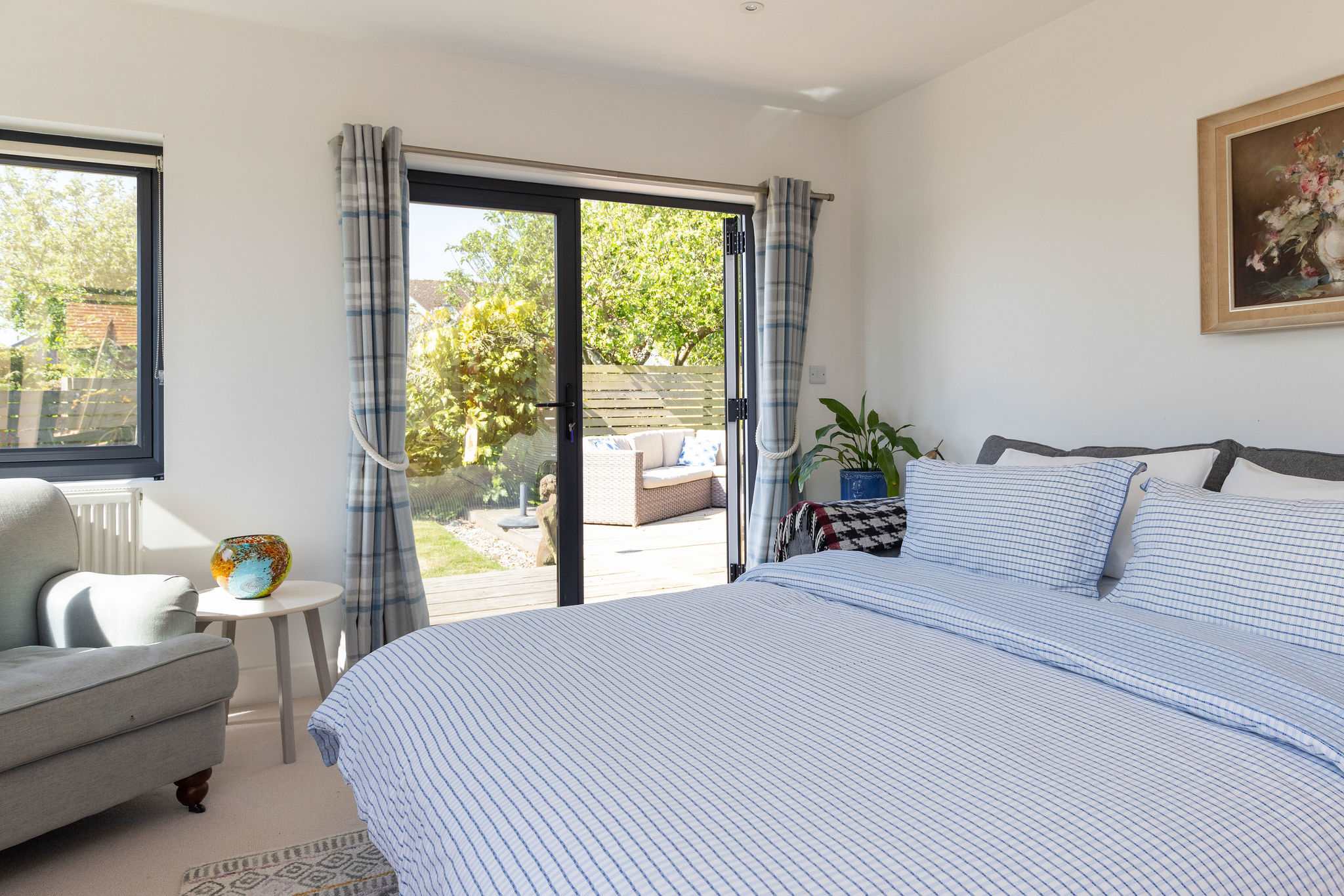 The living room transforms into a second bedroom with a comfy double sofa bed.