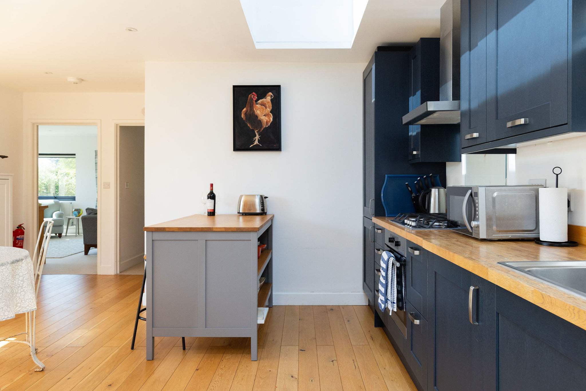 The kitchen island is the perfect spot for a drink or morning coffee.