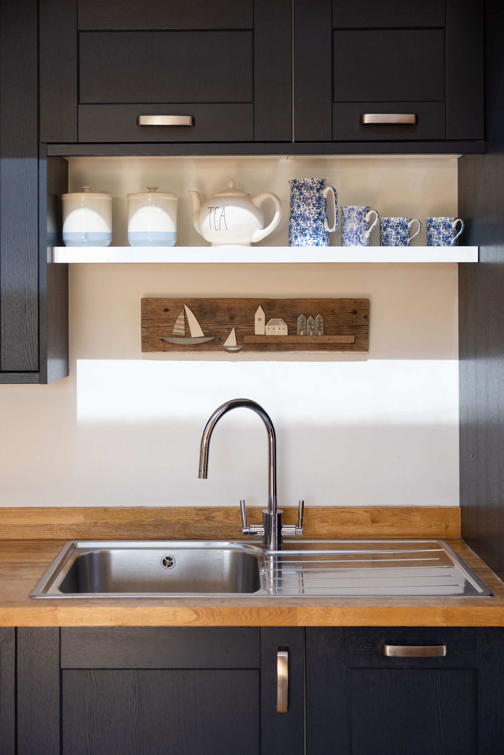 Well-equipped kitchen with charming touches.