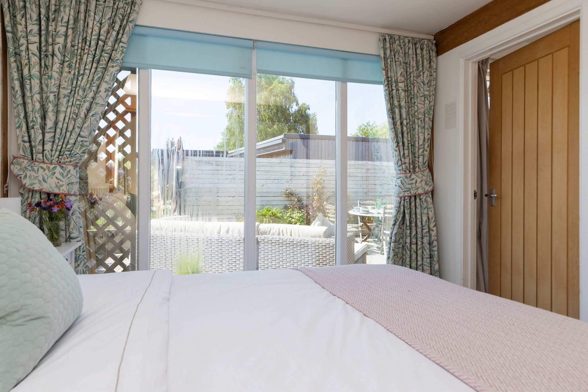This master bedroom has a comfy king bed, with quality linen and bedding.