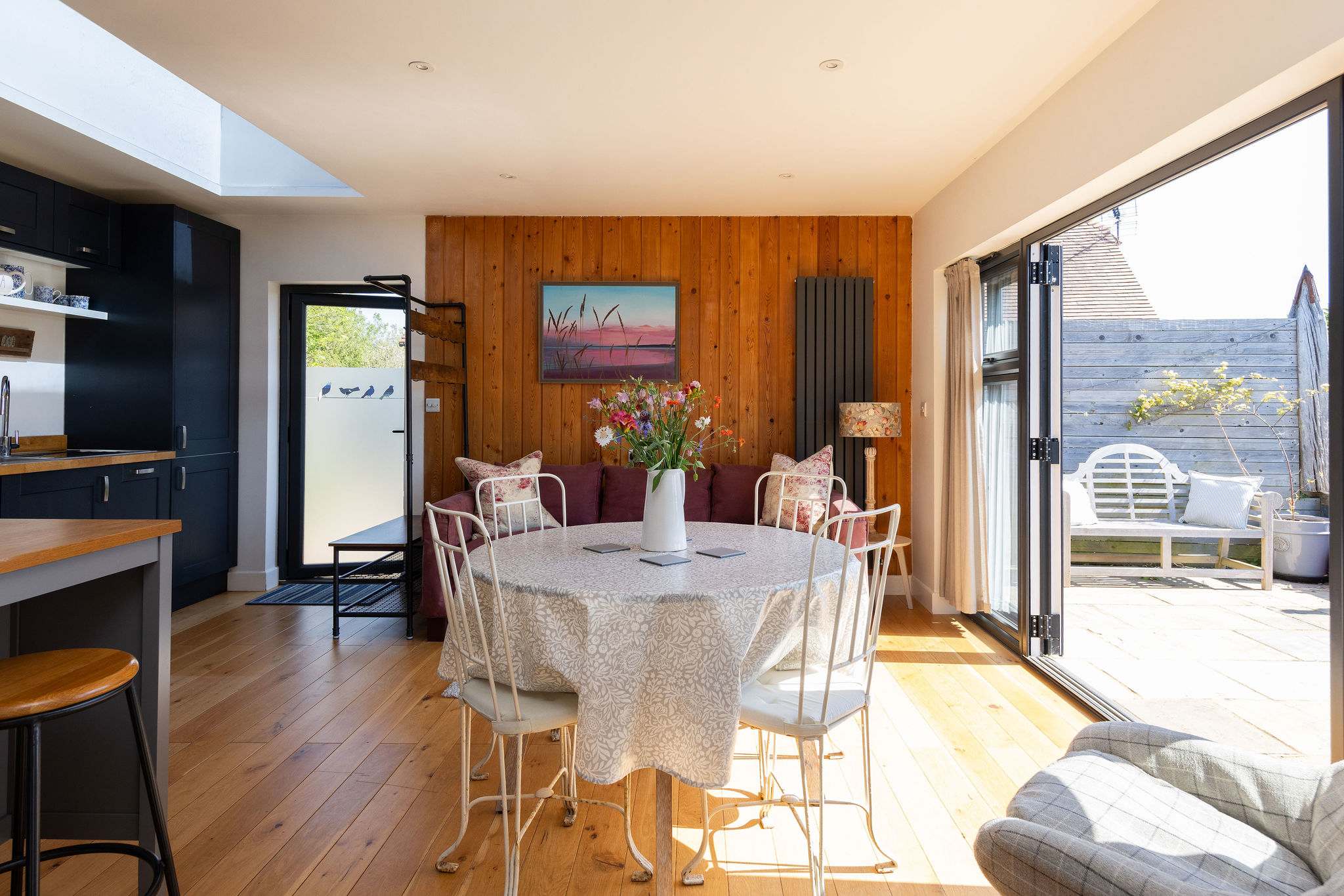 The living space has a dining table for 4 guests, perfect for breakfast.