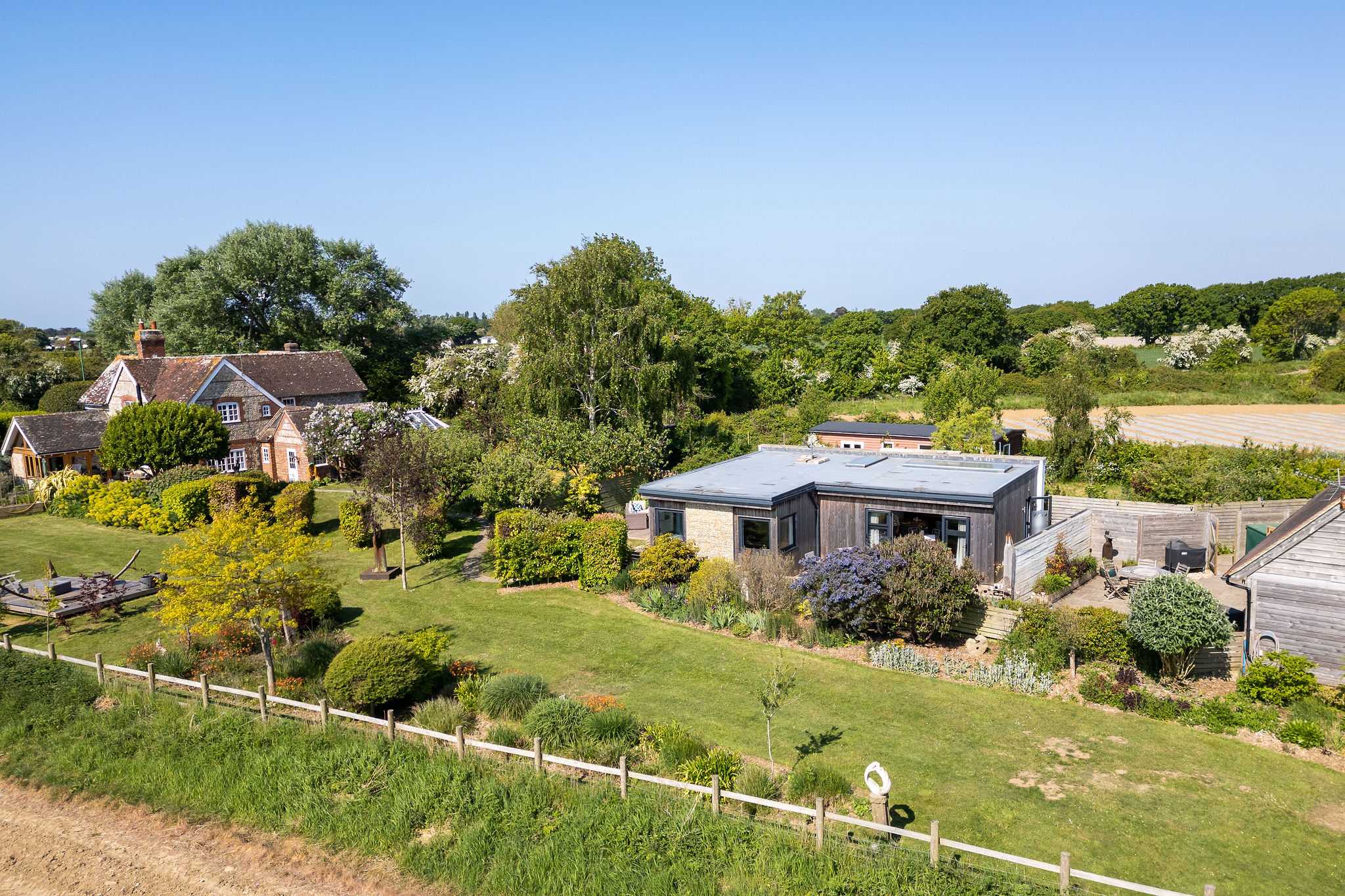 Peaceful rural setting and surrounded by expansive gardens and open views.