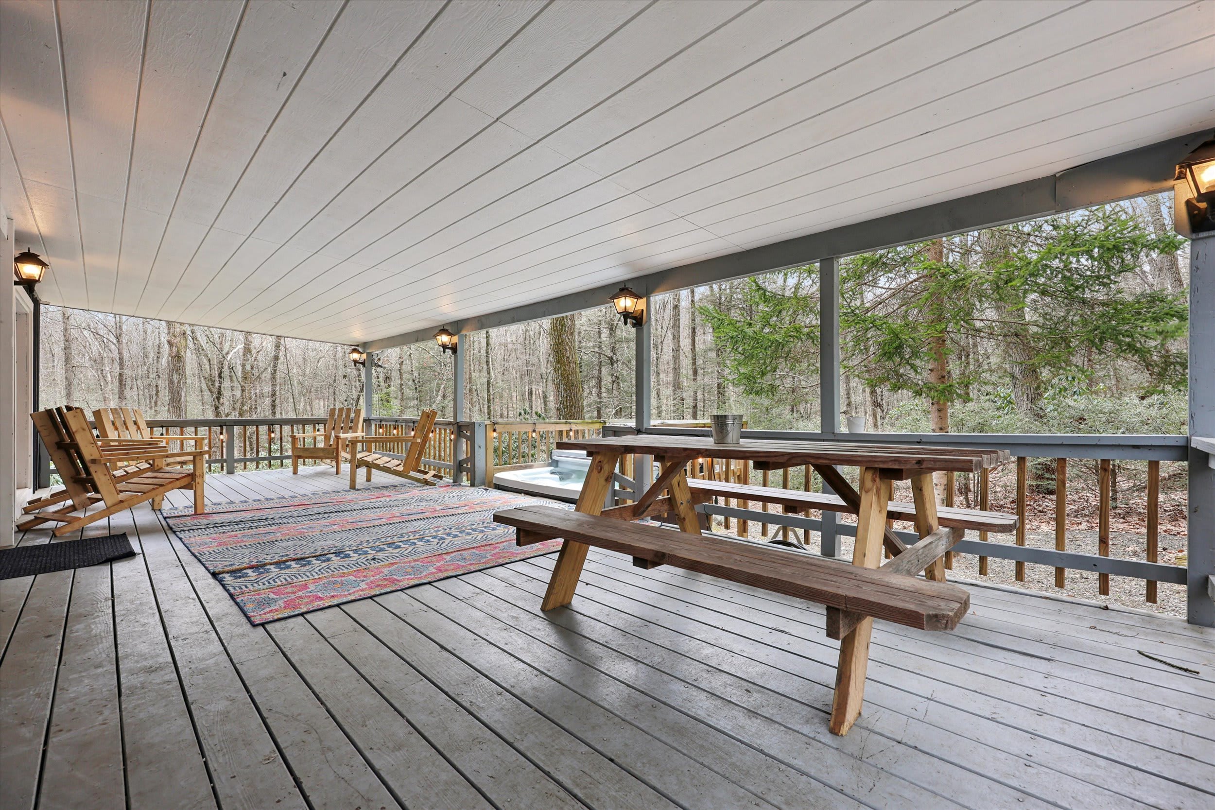 Dine al fresco on the porch, surrounded by trees and away from the bugs.
