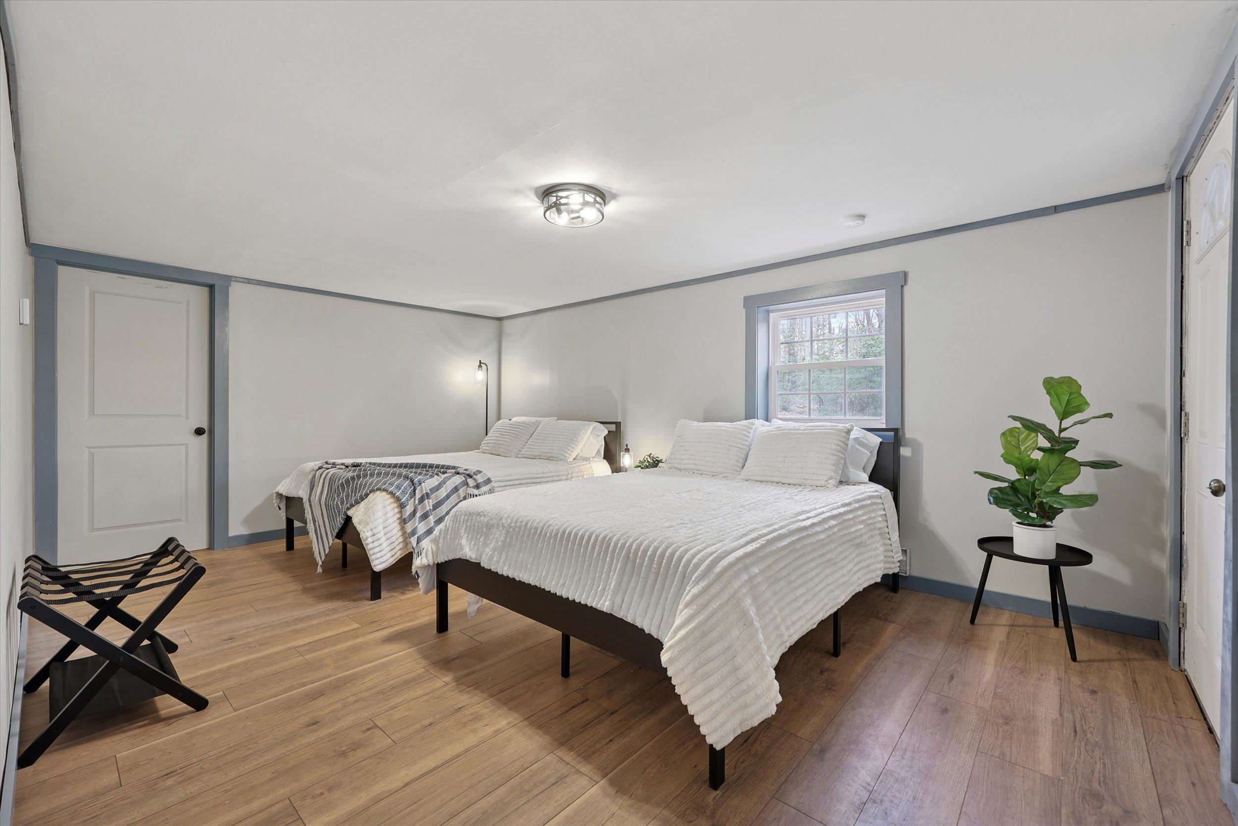 Two beds make this bright bedroom ideal for kids or friends sharing a room.