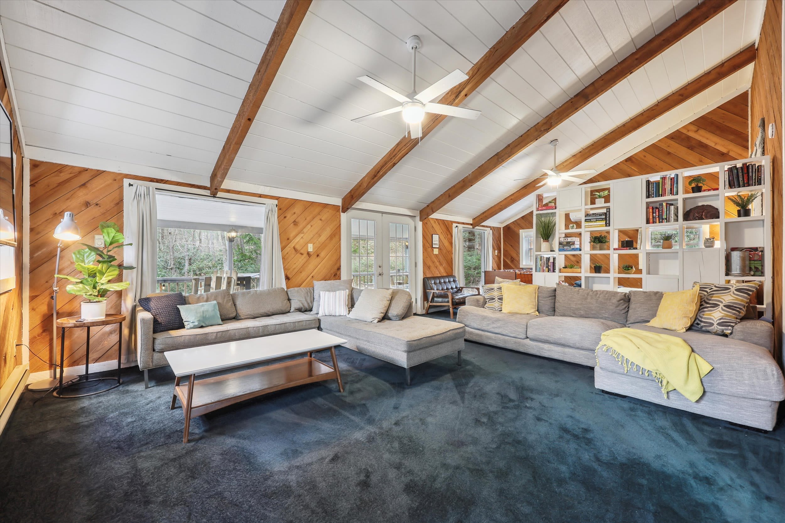 Sink into the sofa with a good book from the built-in shelves in this airy living room.