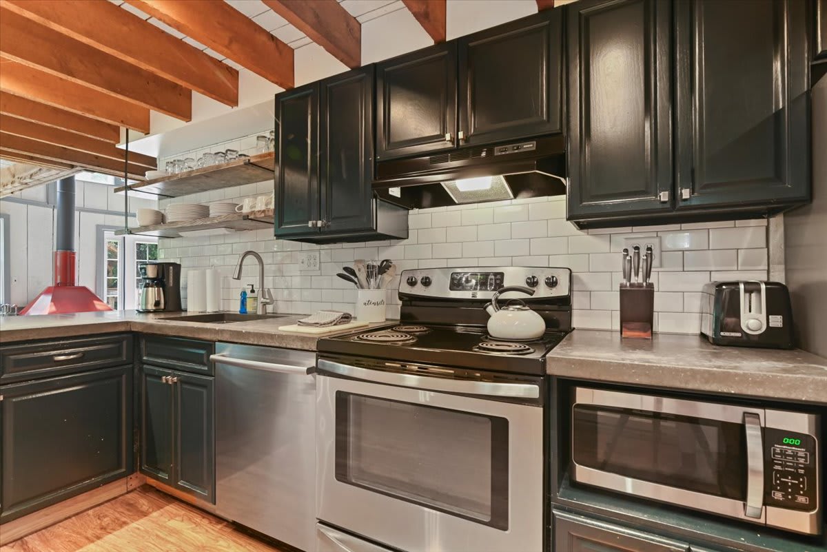 Everything you need to whip up a home-cooked meal awaits in the well-stocked kitchen.