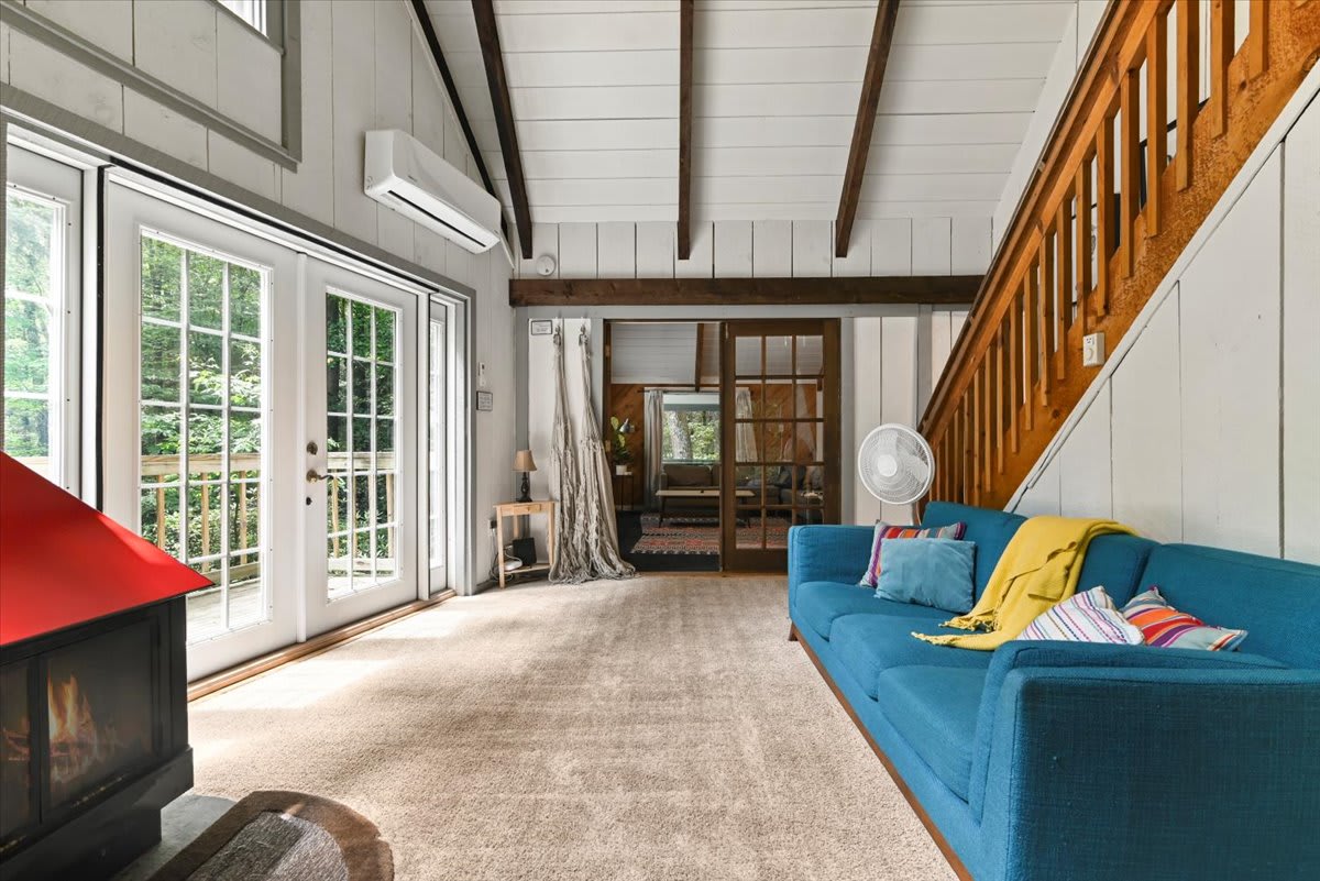 Watch the flames dance in the wood fireplace while the warmth fills the open living space.