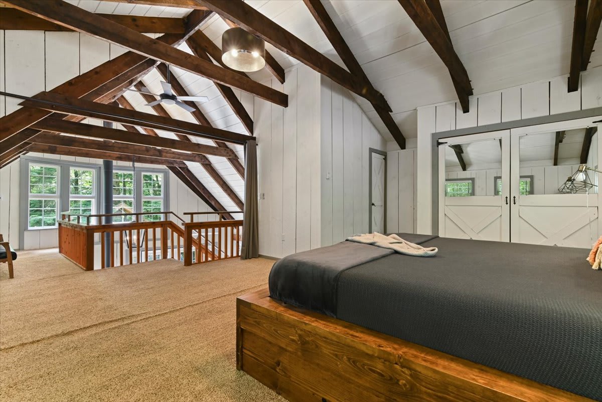 Wake to morning light streaming through the A-frame windows in the loft suite.