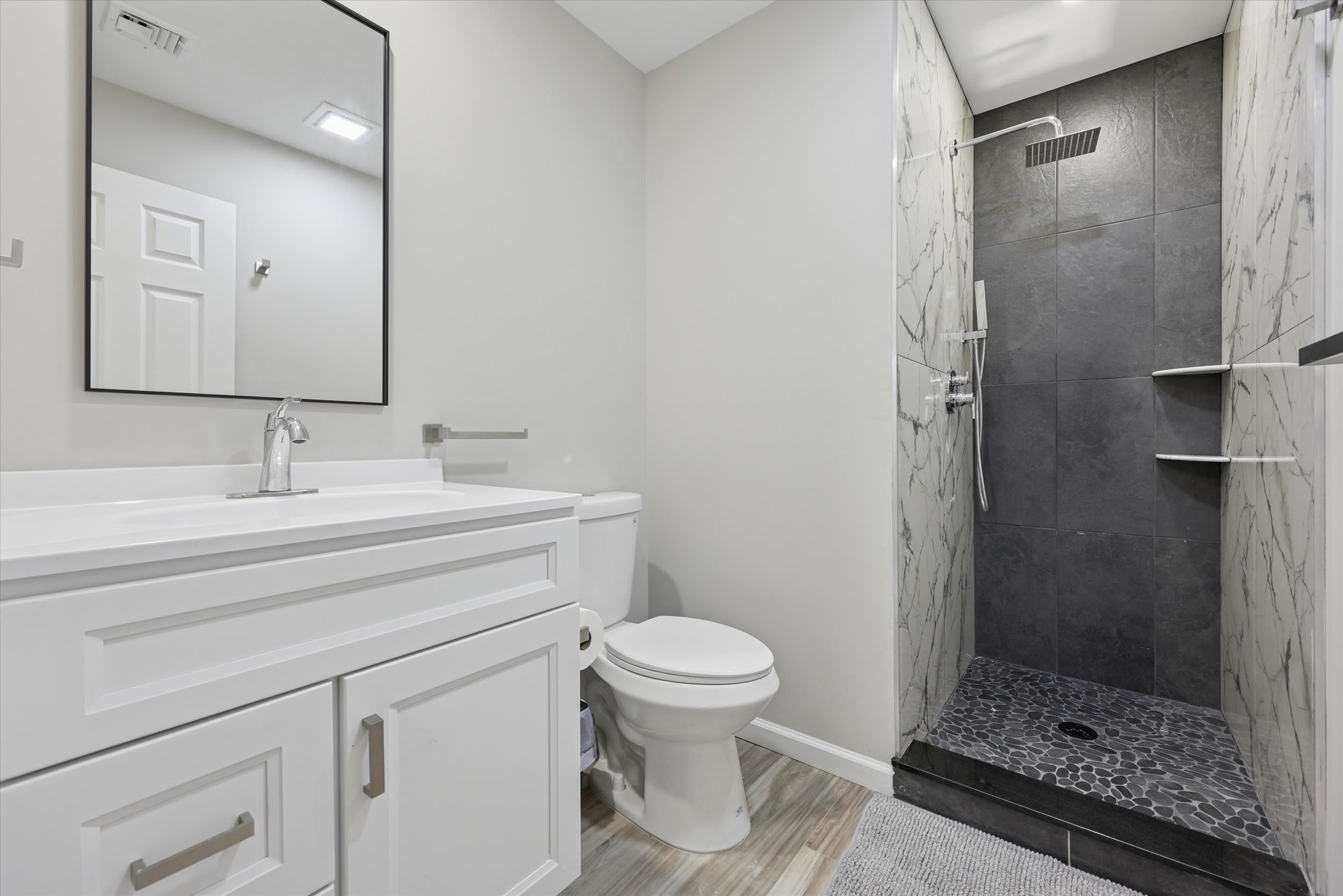 Bathroom with walk-in shower and plenty of counter space