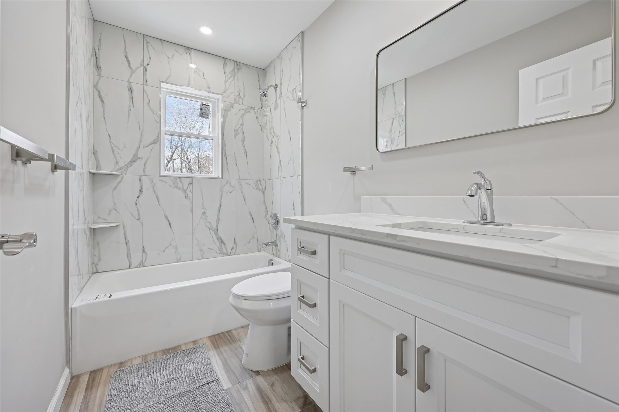 Fresh bathroom with glass shower and modern vanity