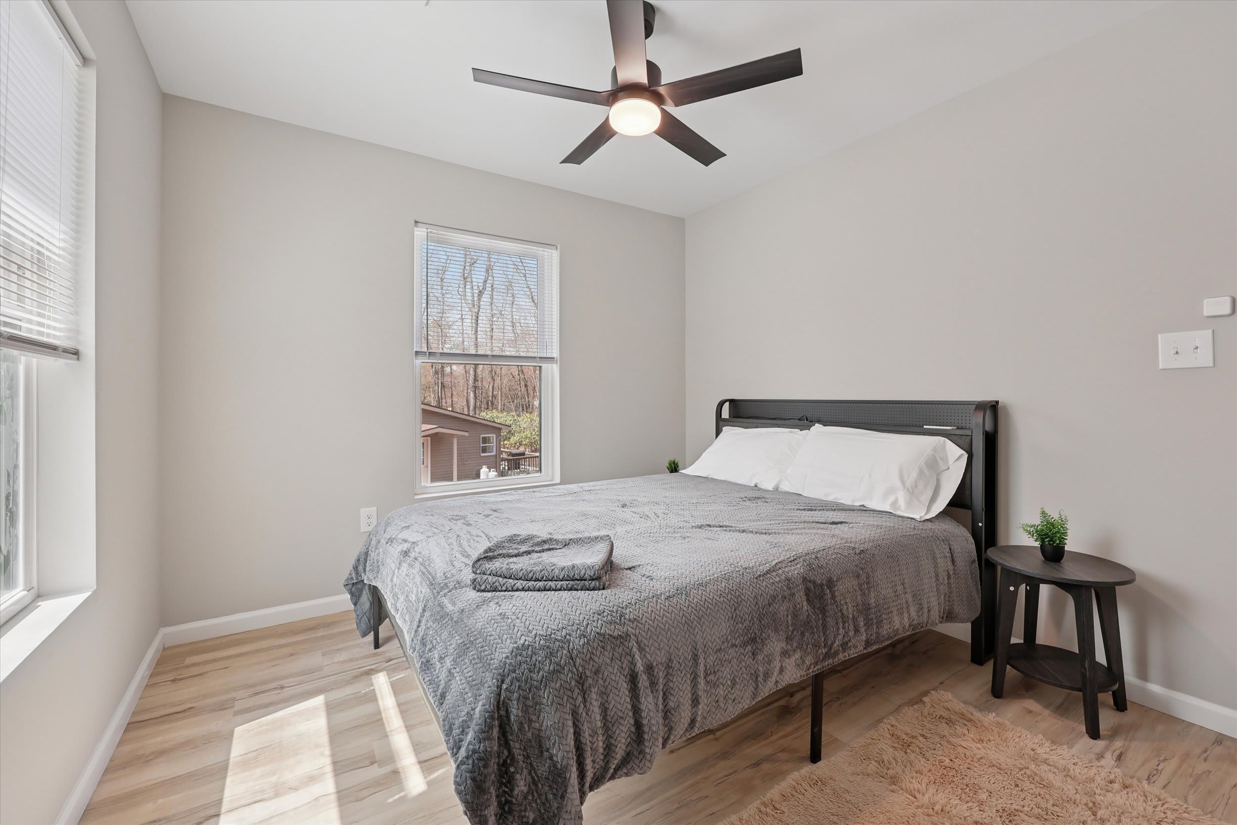 Spacious bedroom with plenty of natural light and storage