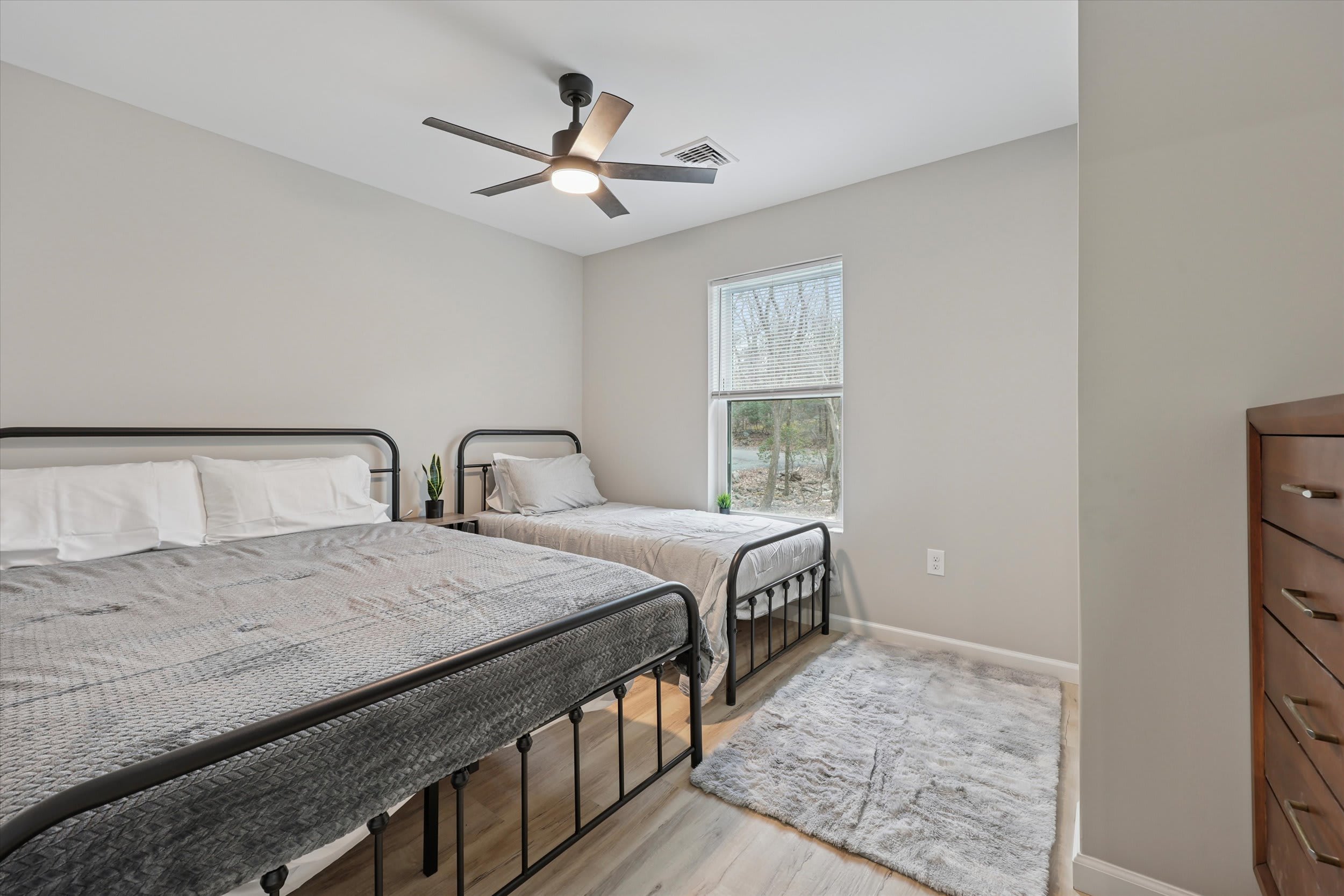 Cozy bedroom with comfortable bedding and soft natural light