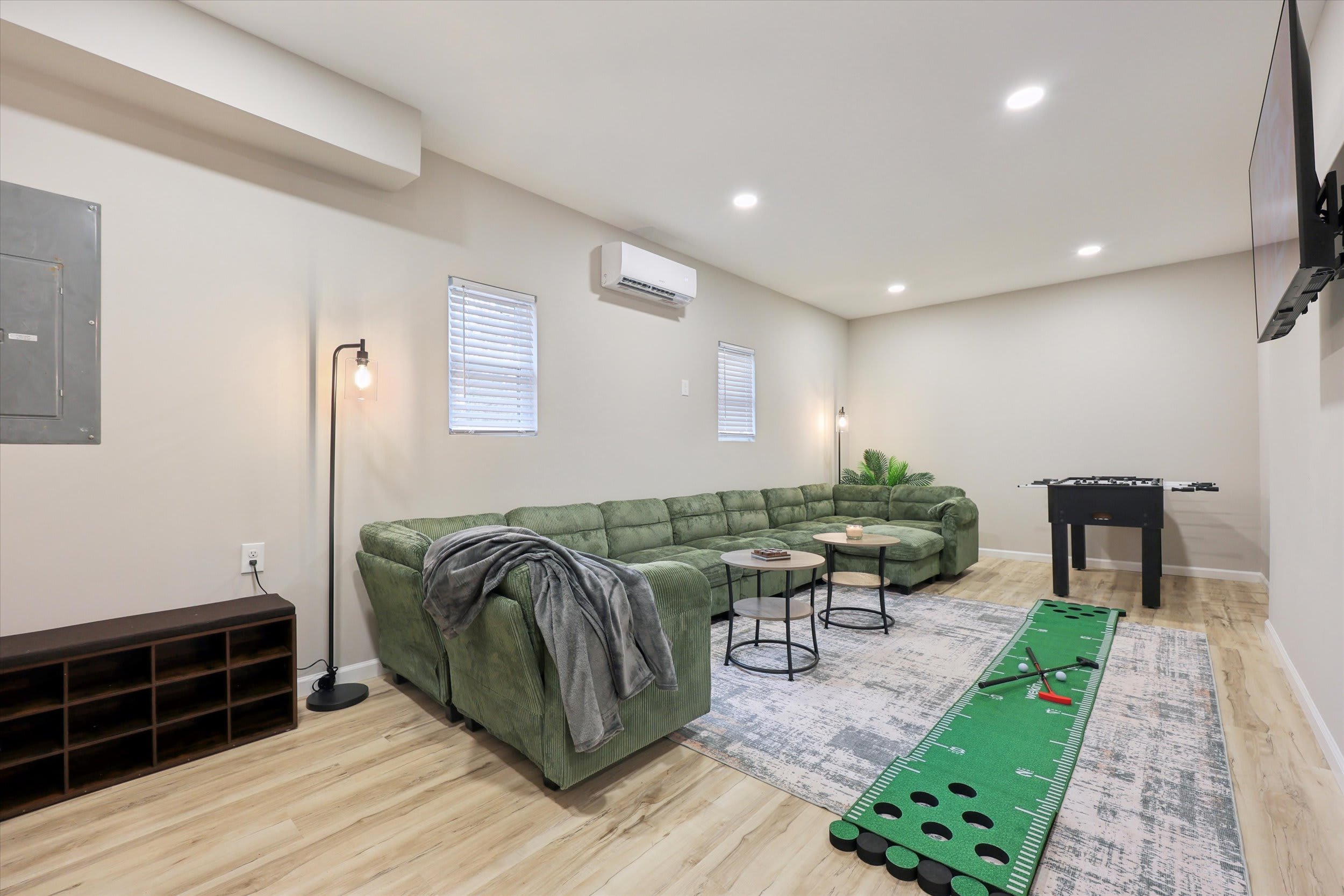 Hang out in the lower level game room with foosball table and comfy seating