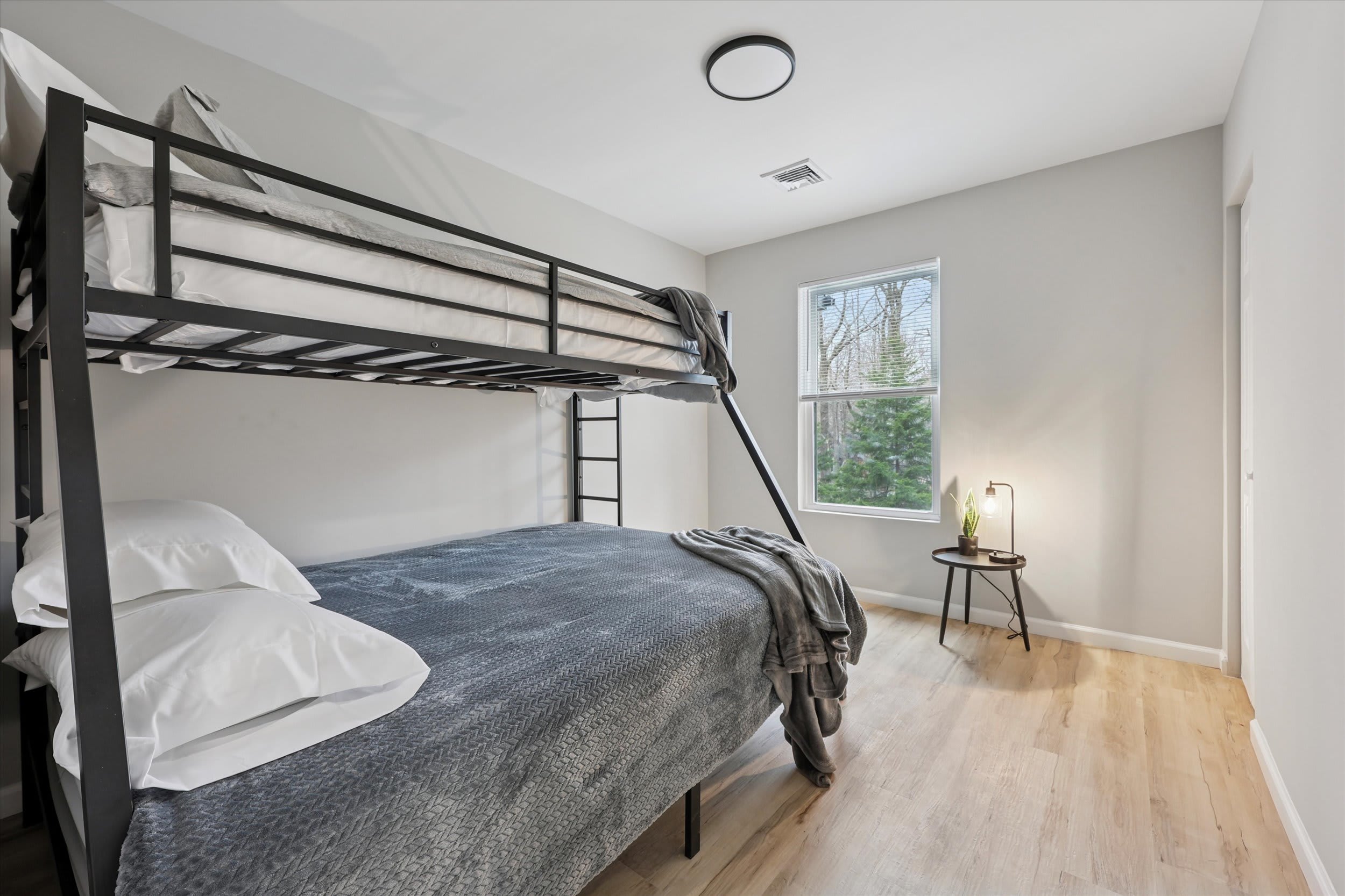 Bunk bed room with cozy stone accent wall for a restful sleep