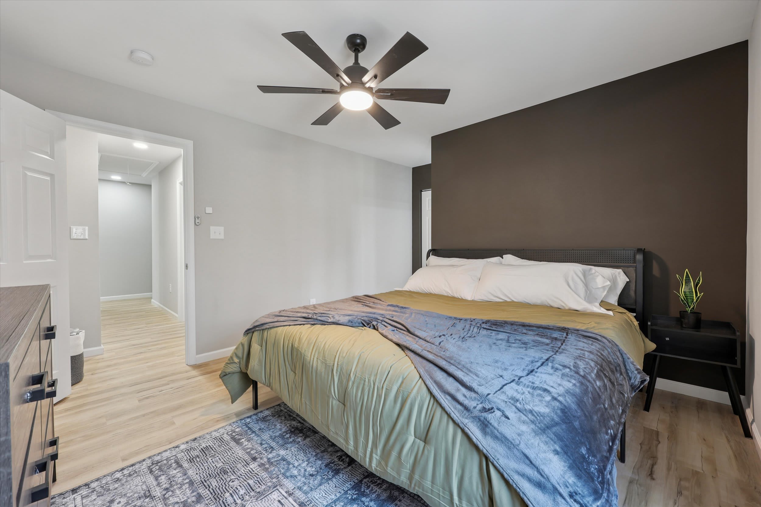 Spacious king bedroom with cozy bedding for a great night's sleep