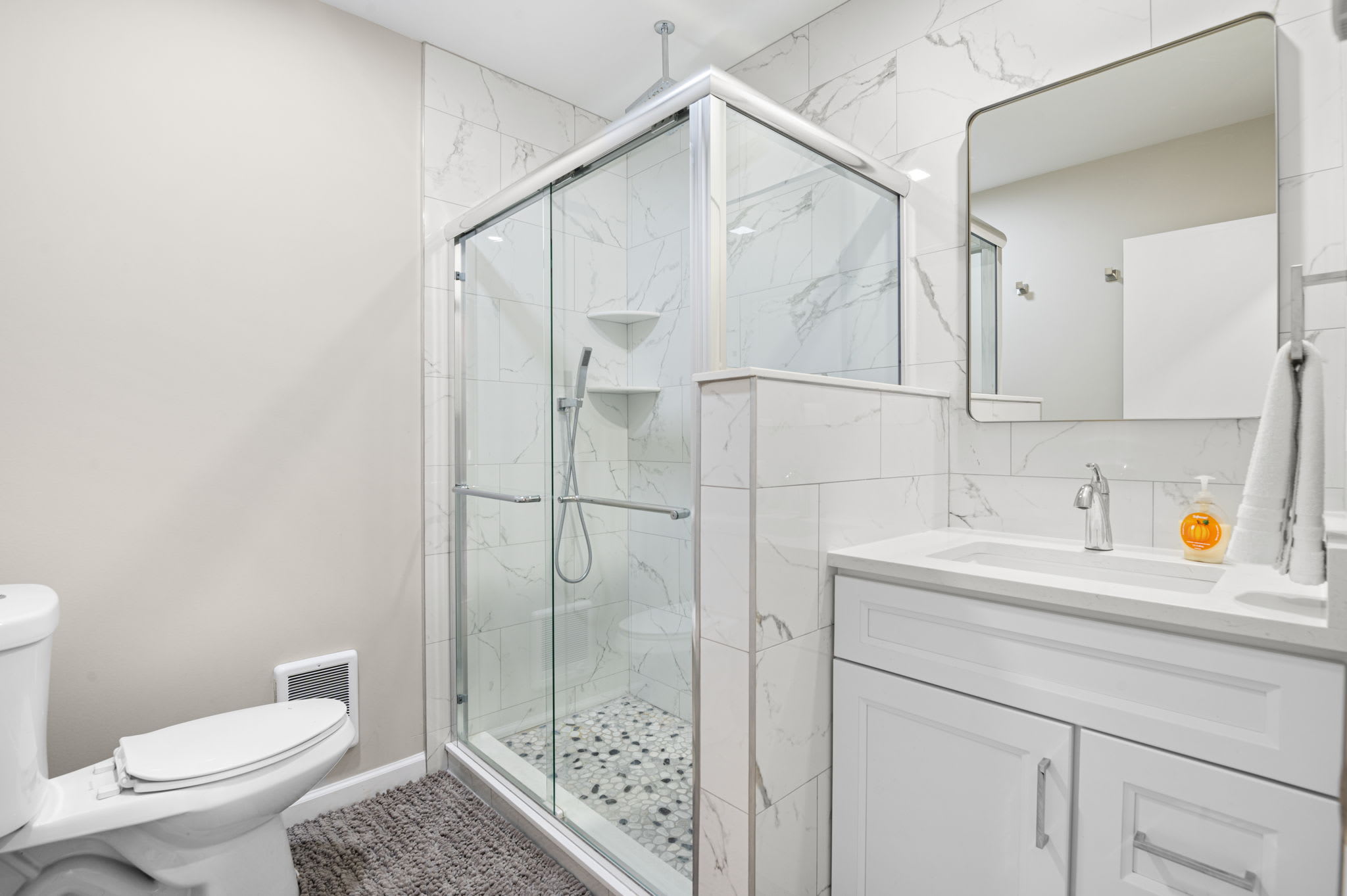 Modern bathroom with glass-enclosed shower and stylish vanity for a spa-like experience